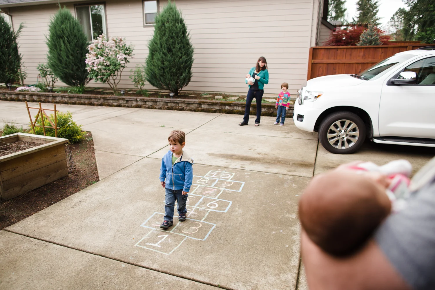 family outside in front yard