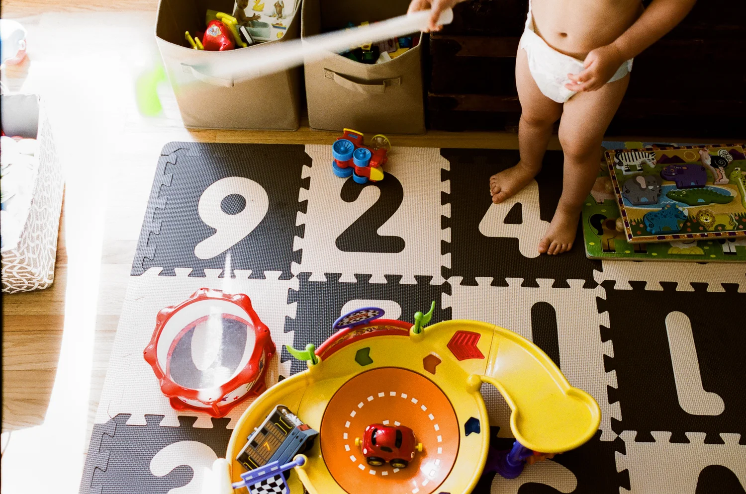 boy playing with toys at home