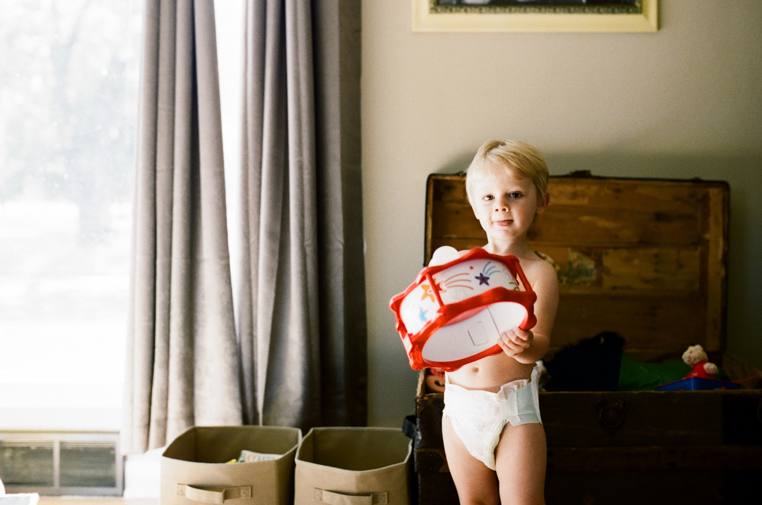boy playing with toys at home