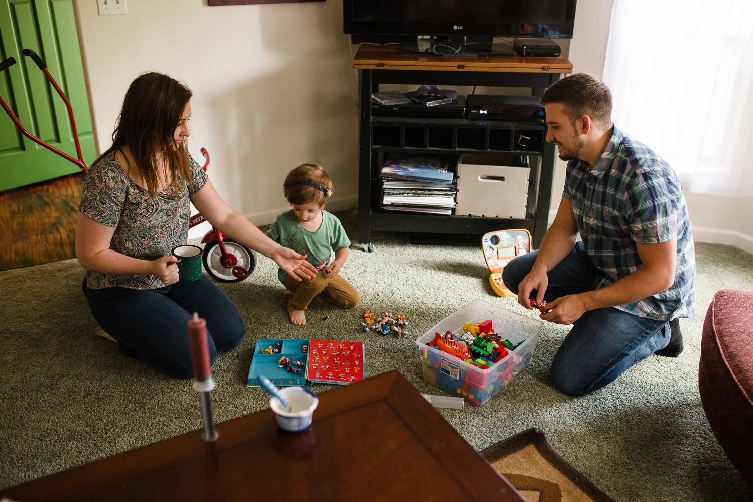 family playing together on floor