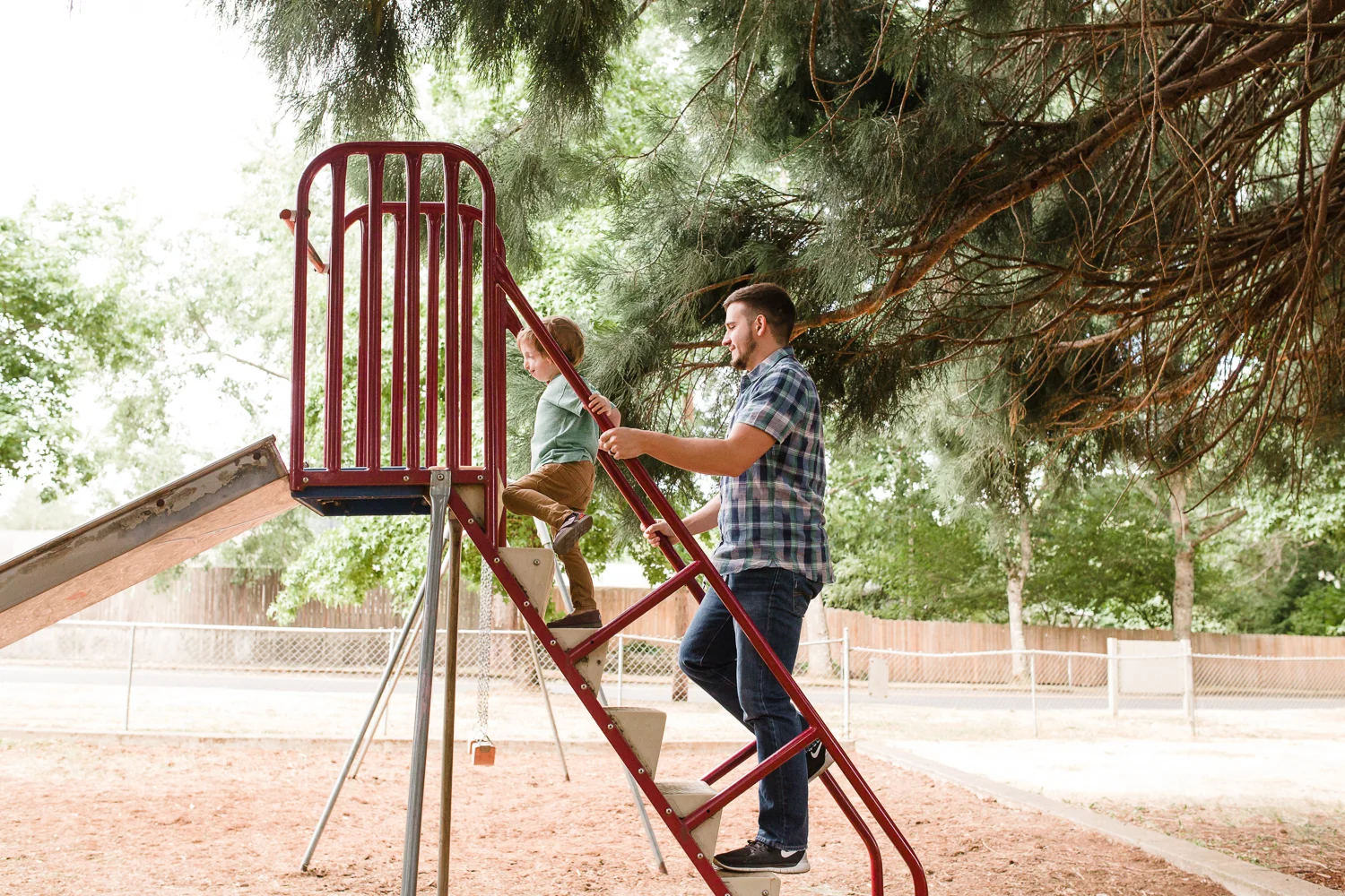 climbing up a ladder to go down a slide