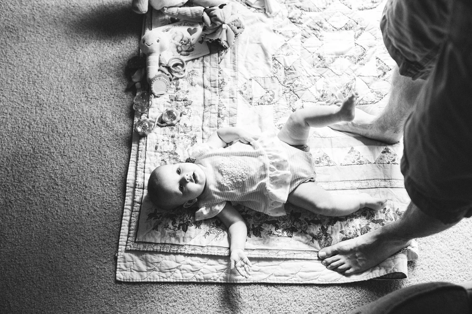 dad playing with his infant daughter