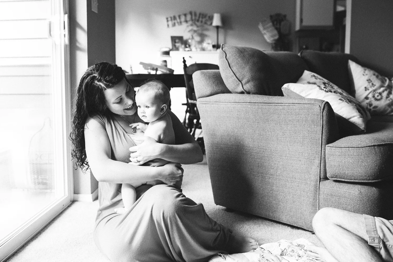 mom embracing infant daughter