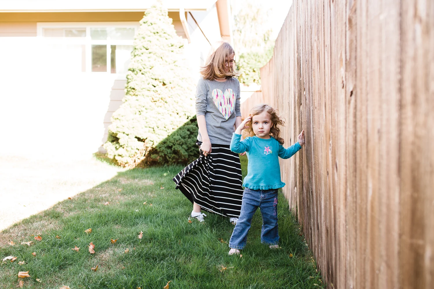 sisters playing in the back yard