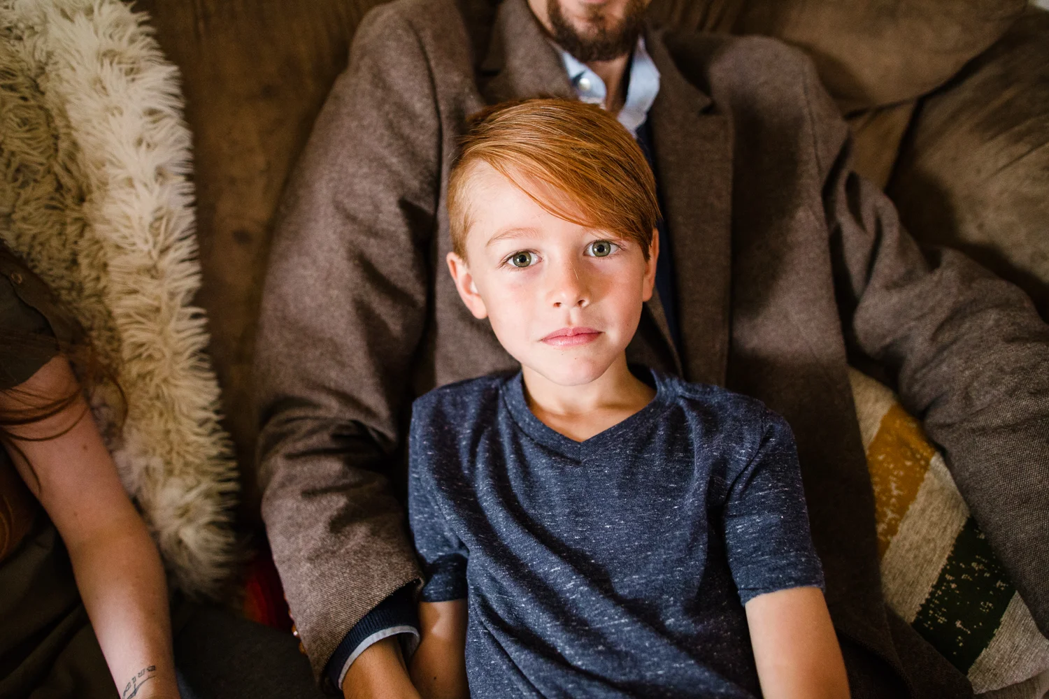 boy with red hair and blue shirt
