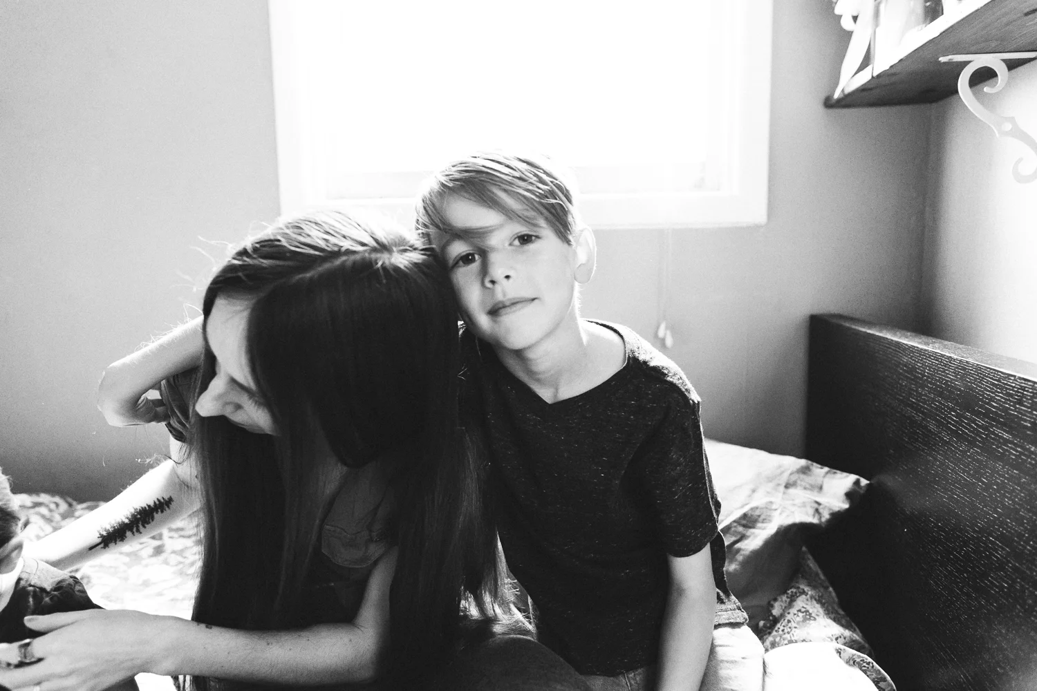 boy embracing his mom
