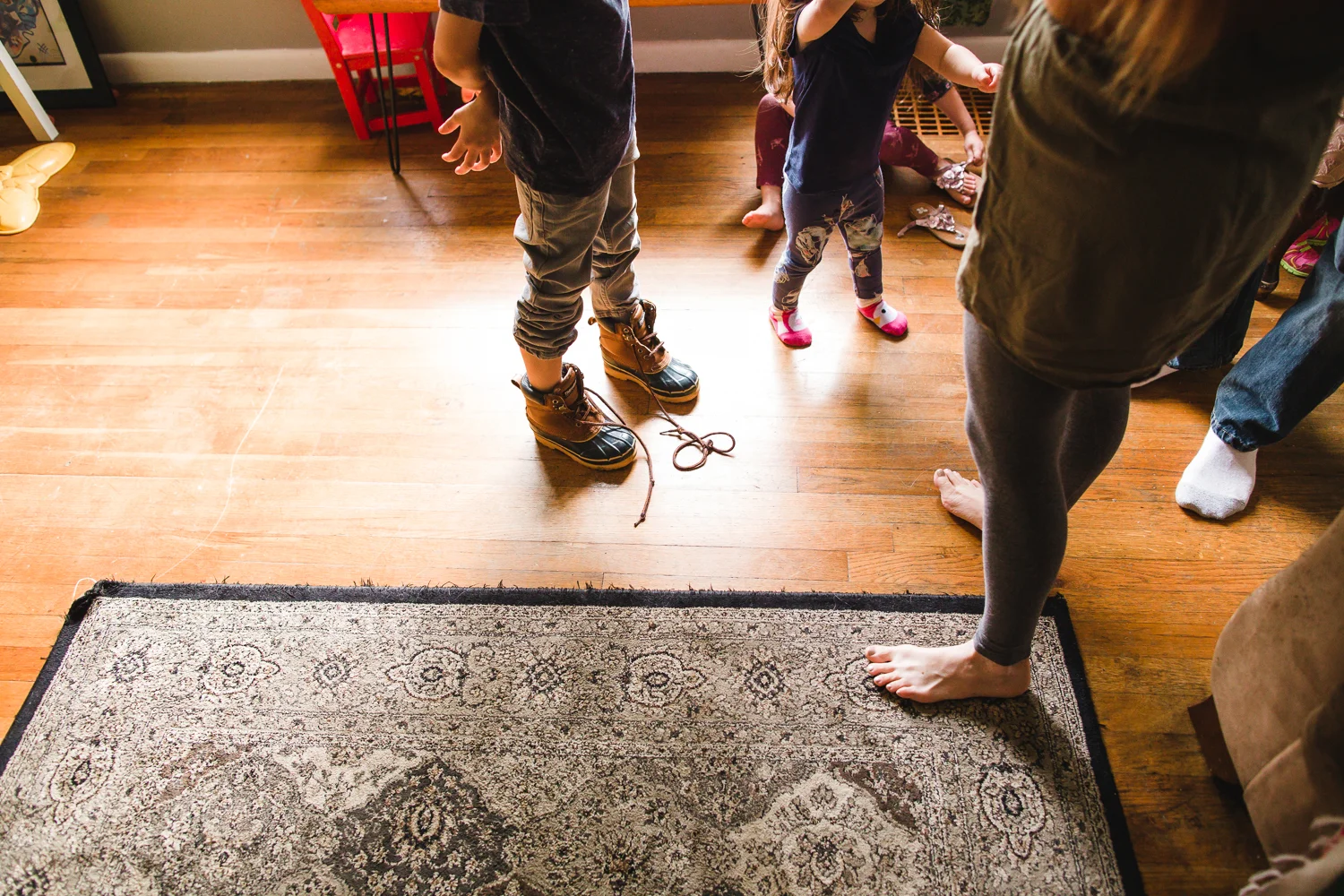 family getting on shoes