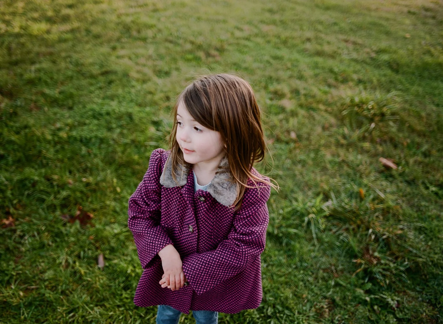 child with pretty purple jacket