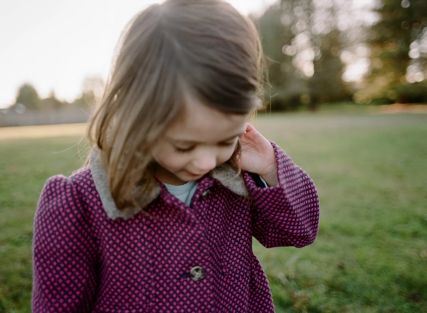 child with pretty purple jacket