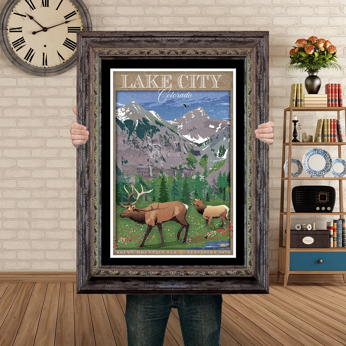 Man Holding Poster Mockup Barnwood lake city valley elk.jpg