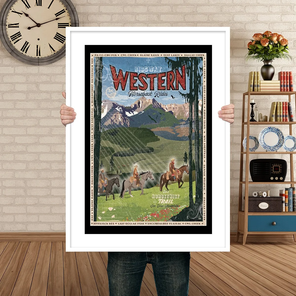 Man Holding Poster Mockup Ridgway horseback.jpg