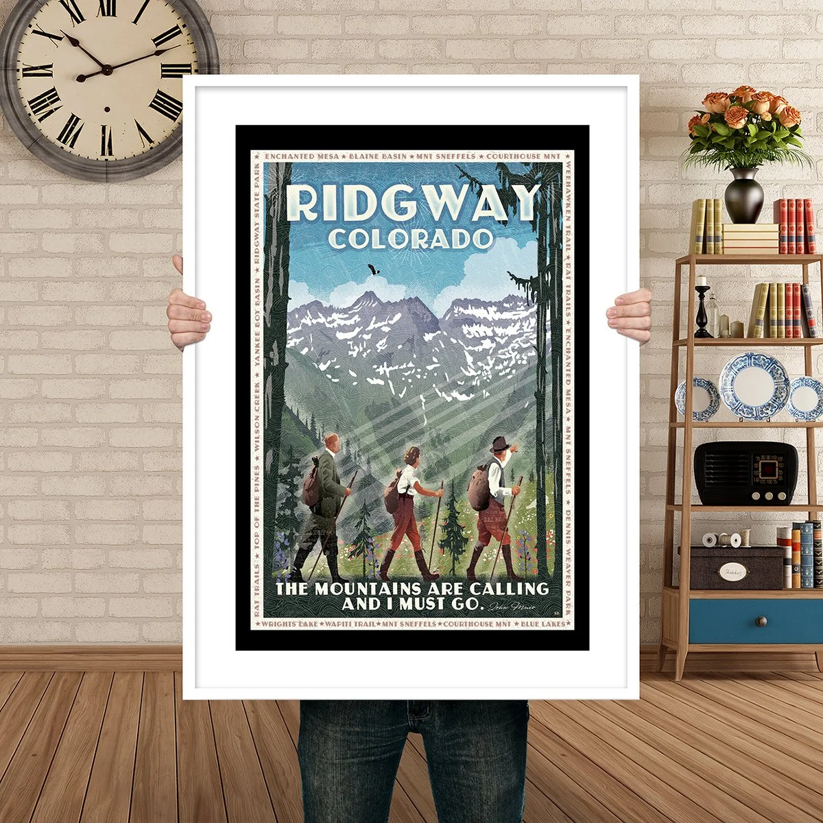 Man Holding Poster Mockup Rdigway Mountain are calling.jpg