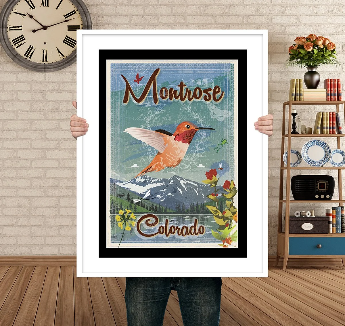 Man Holding Poster Mockup Montrose Humingbird.jpg