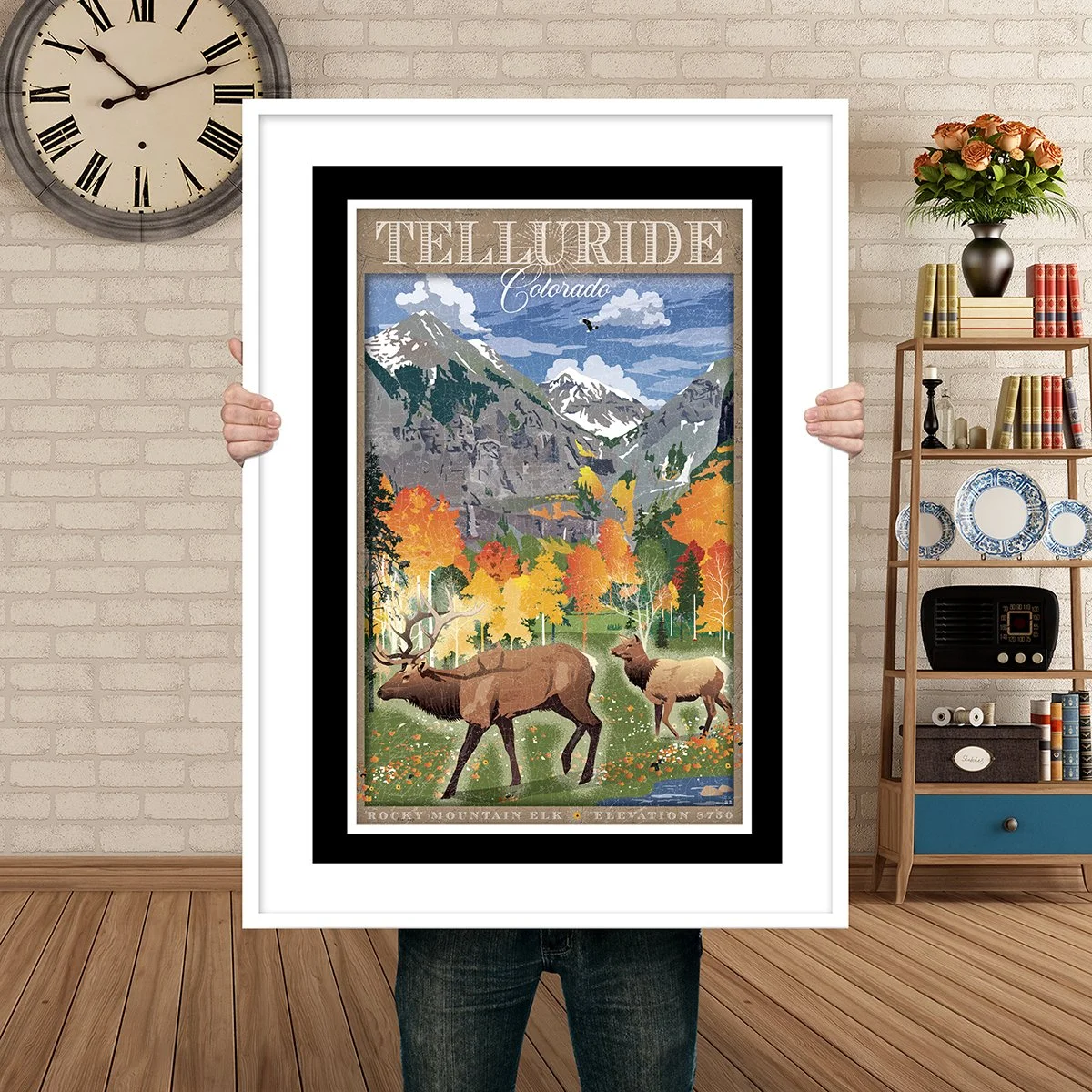 Man Holding Poster Mockup Fall valley floor elk.jpg