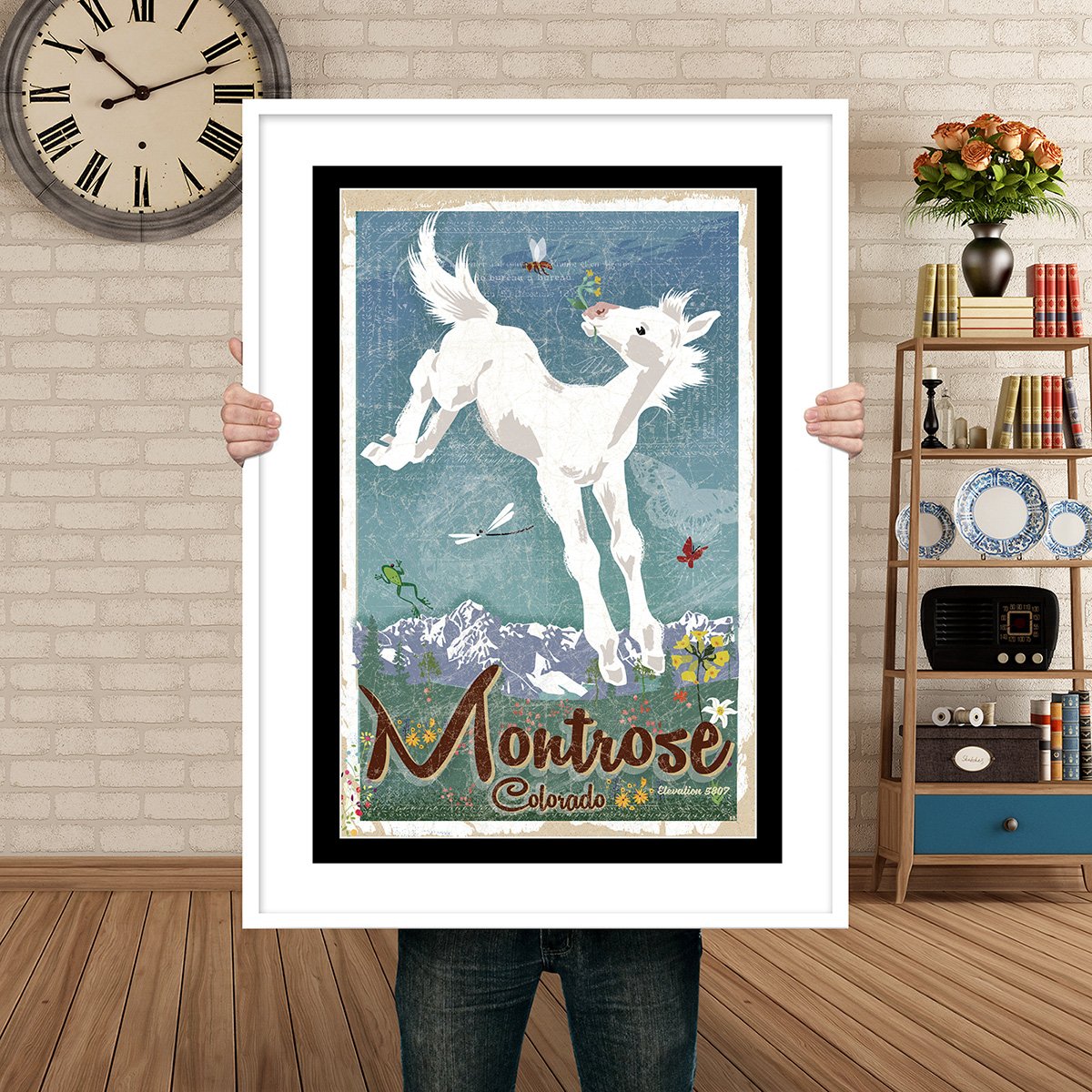 Man Holding Poster Mockup Spring Pony Montrose.jpg