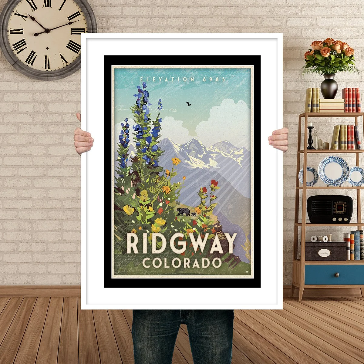 Man Holding Poster Mockup Ridgway bear wildflowers.jpg