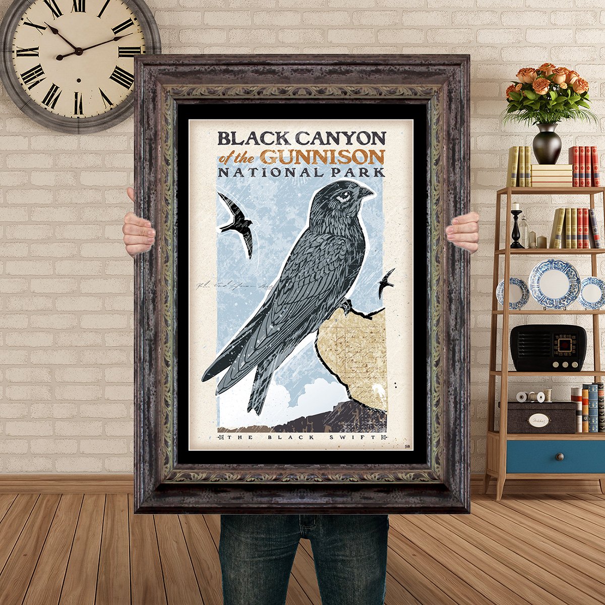 Man Holding Poster Mockup Barnwood the black swift.jpg