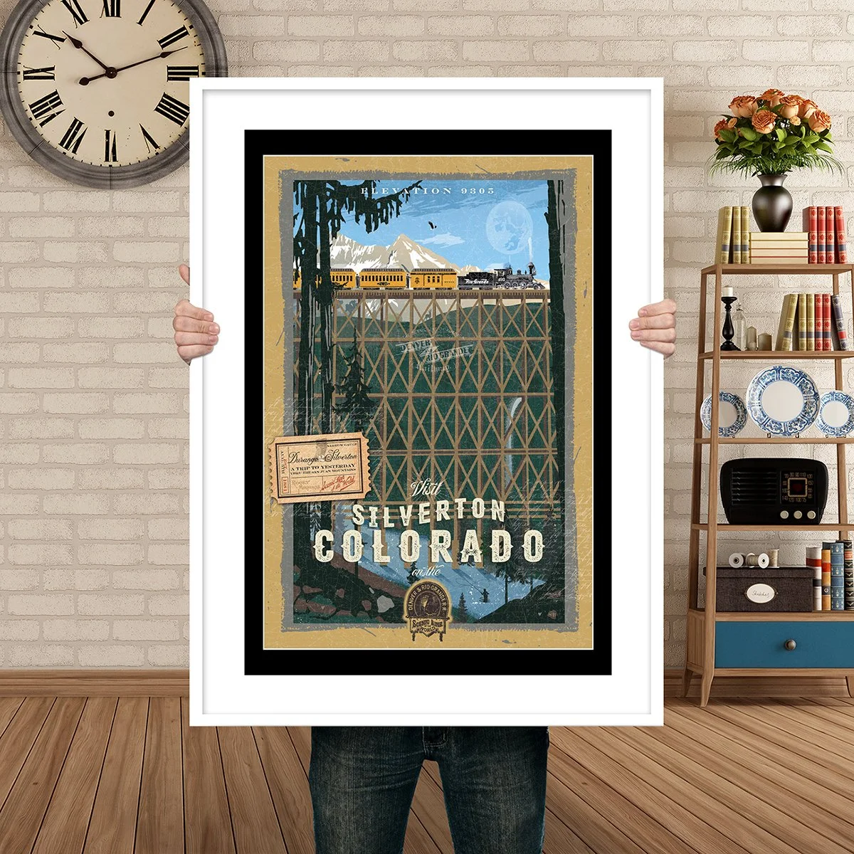 Man Holding Poster Mockup Silverton train.jpg