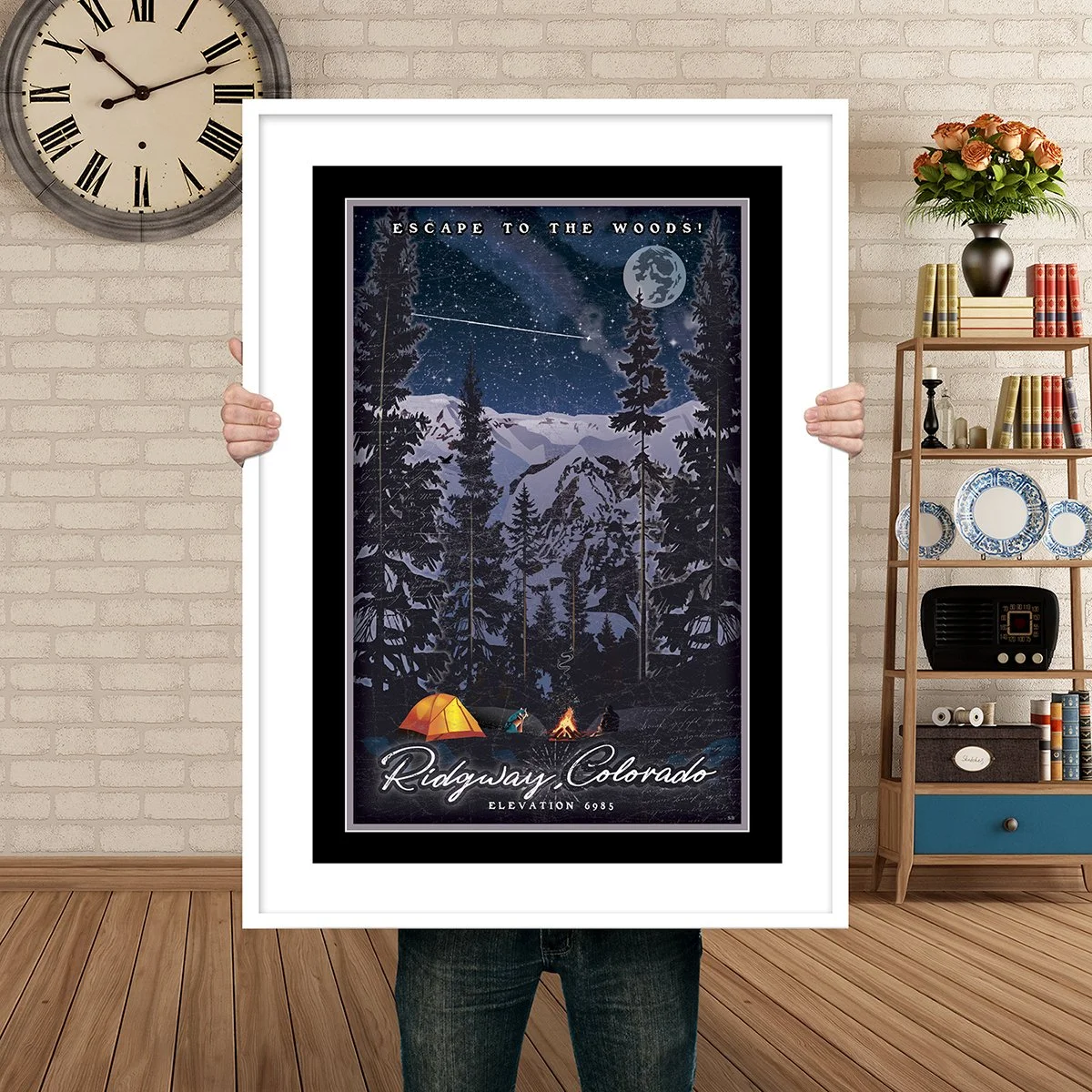 Man Holding Poster Mockup esacpe to the woods ridgway.jpg