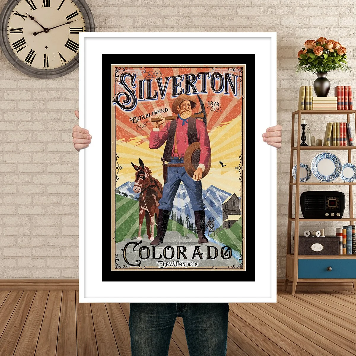 Man Holding Poster Mockup Silverton miner.jpg