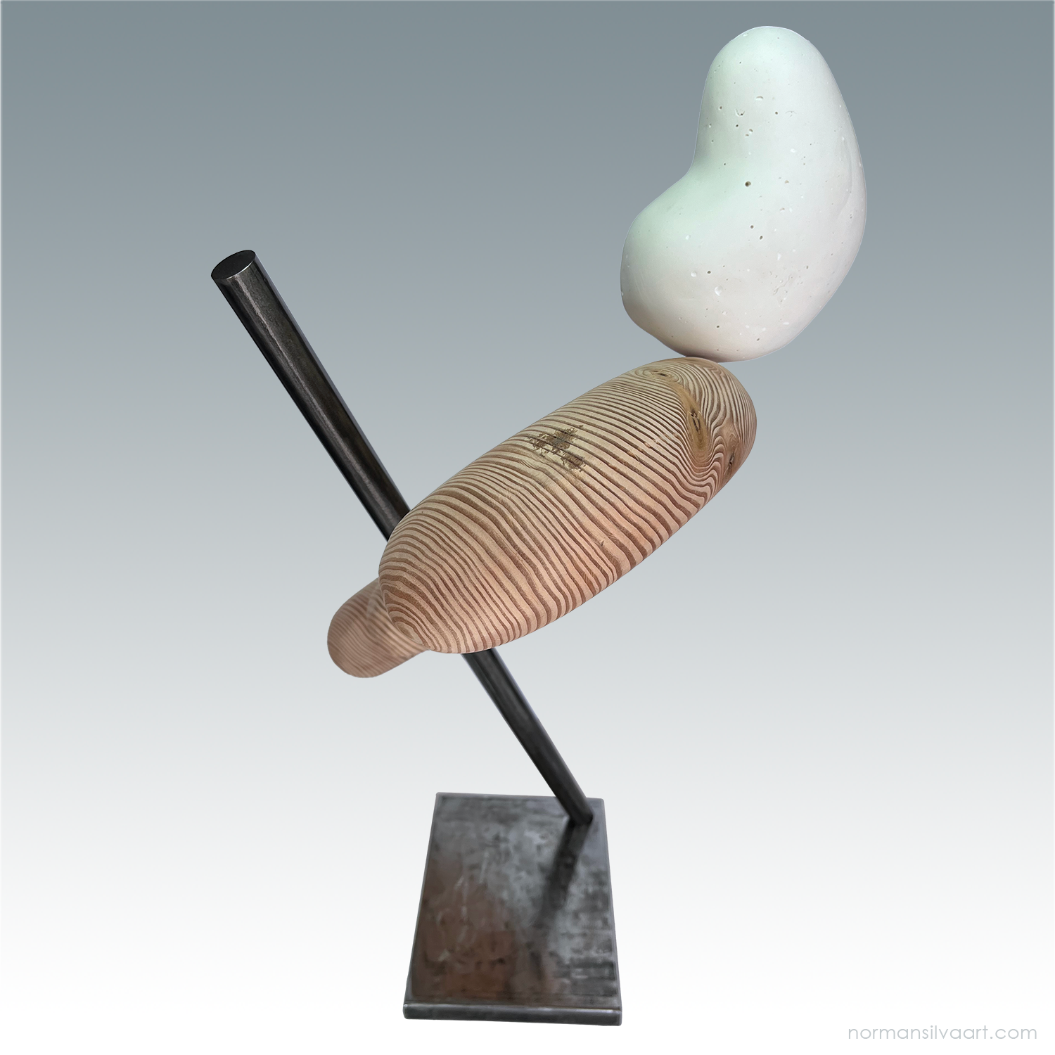 Bulbous plaster form resting on abstract wood biomorphic shape