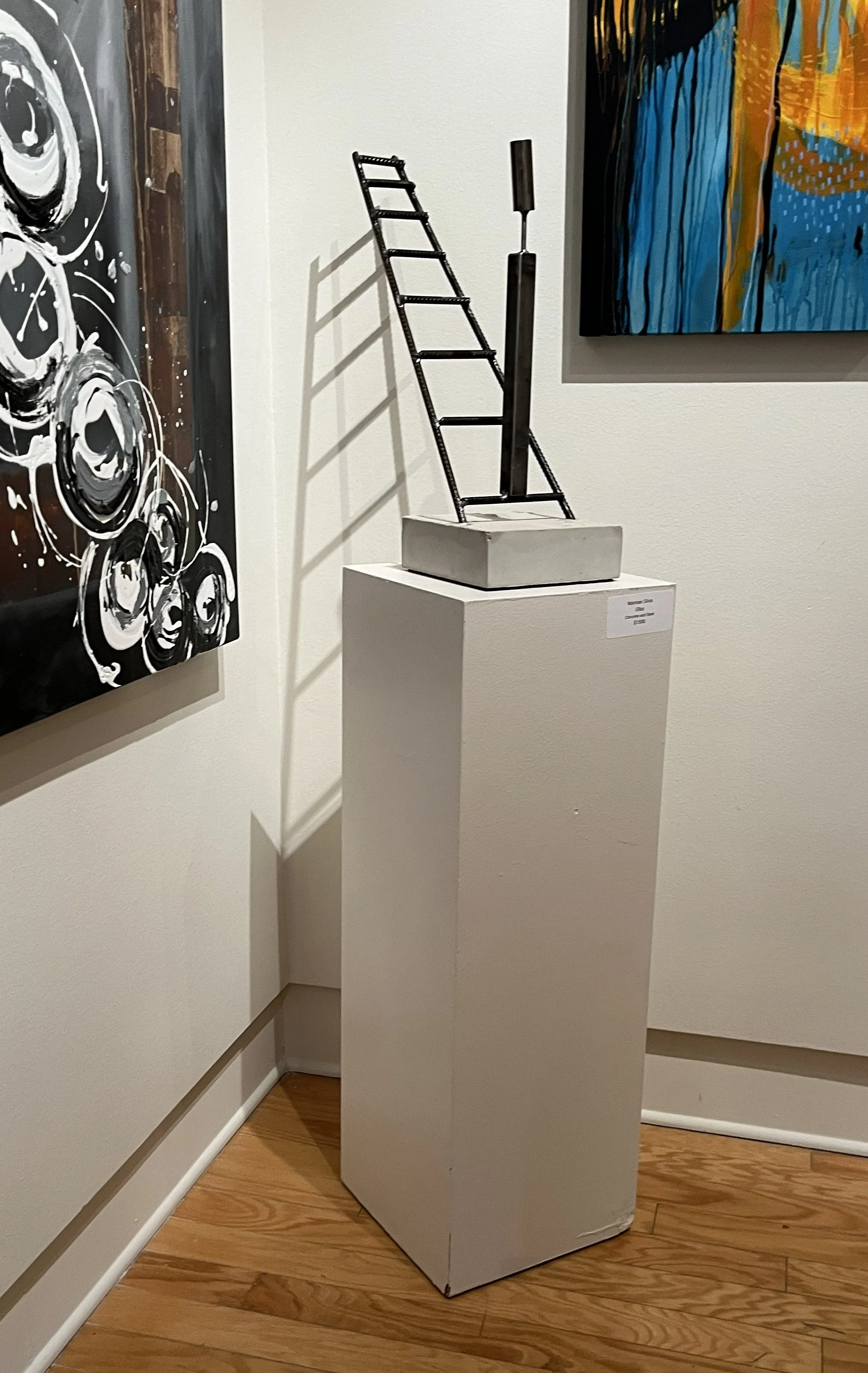 Sculpture by Norman Silva called "Ellas". It's made of steel and concrete.