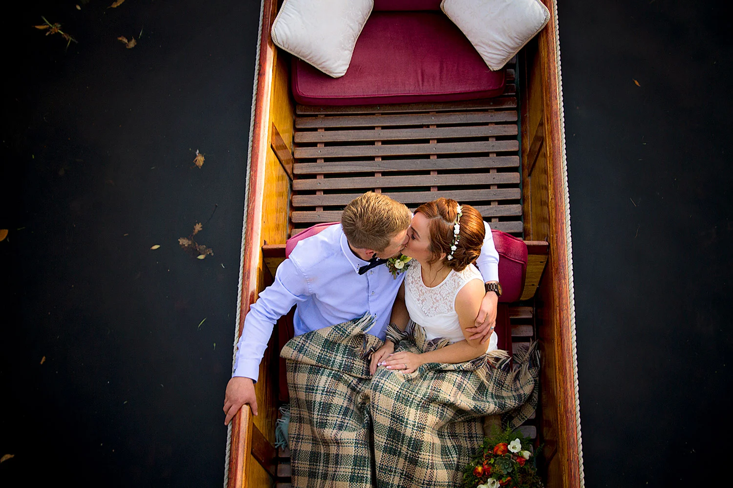 engaged couple in a boat.jpg