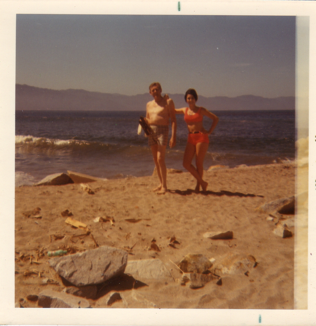 My dad and me in my one piece swim suit that my mom cut in half. 1970