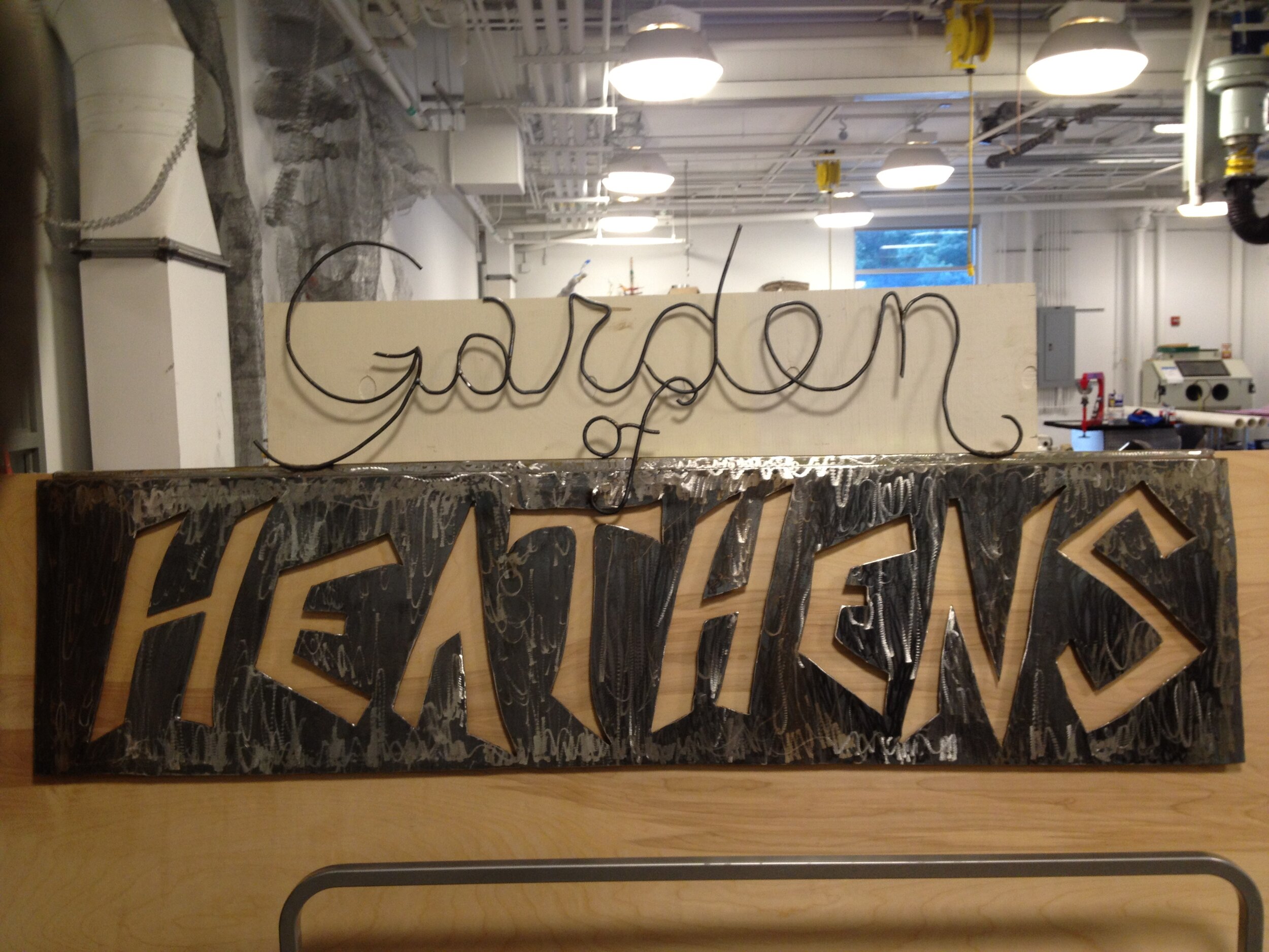 Garden of Heathens sign