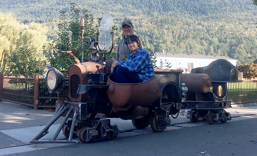 phoebe and grampa in rail truck.png