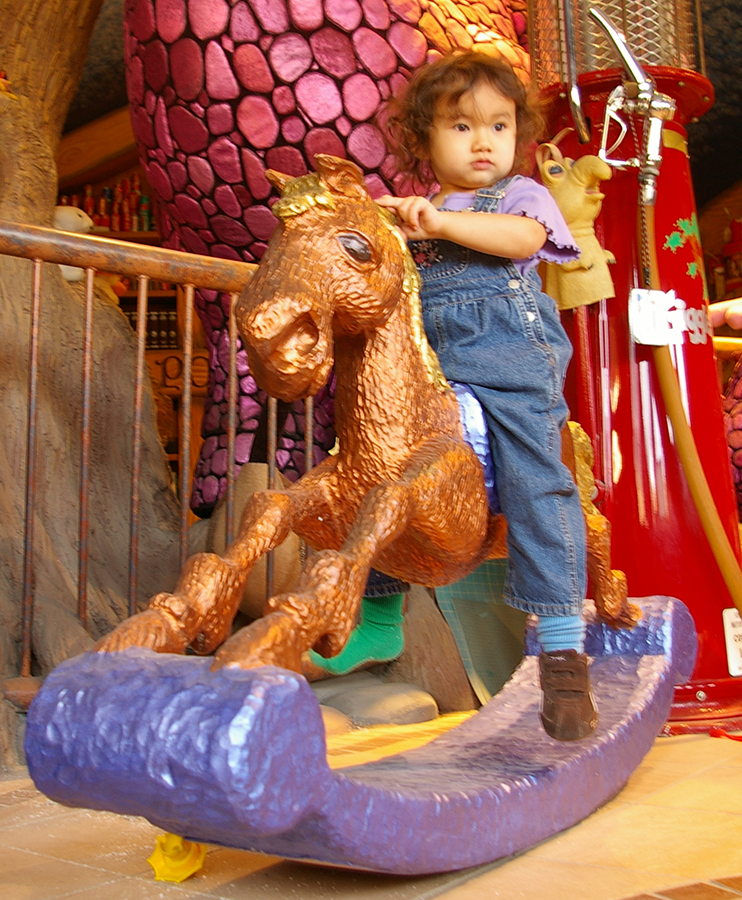 phoebe on rocking horse.png