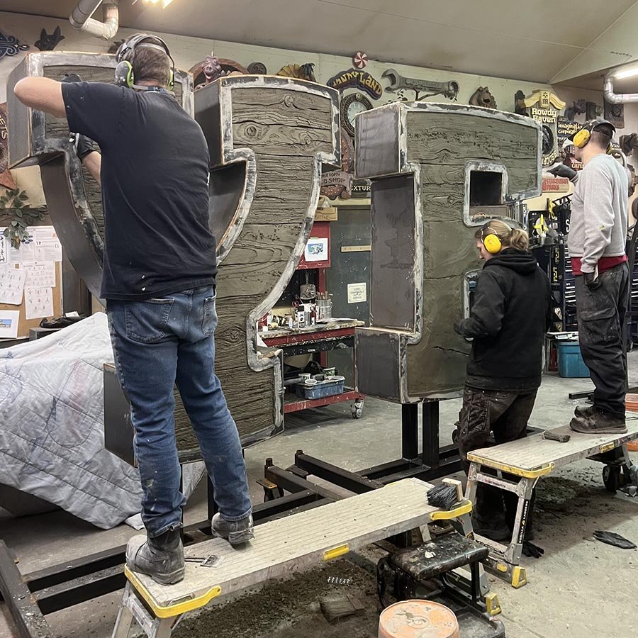 First letters sculpted — Imagination Corporation