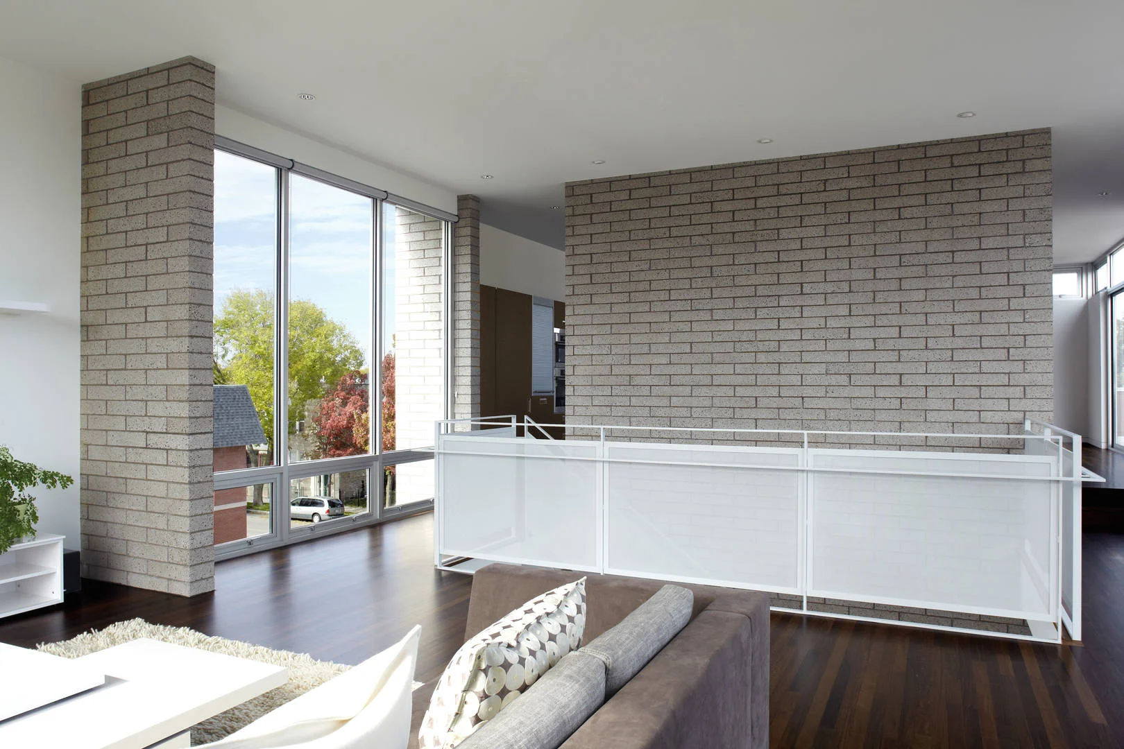 3701 S Parnell Single-Family Home Location: Chicago, IL Photos: Marty Peters Project Description: “Transparent Glimpses” In this residence, the standard organization of main public levels on the first floor and private bedroom levels on the upper floors was re-envisioned. Instead, the main public level was pushed to the top floor and designed as an open plan to take advantage of the natural light and city views. To keep a connection from the main entry to this level, a large gracious foyer and stair atrium was created and extended through all levels of the residence. The main feature of this residence is the “hidden garden” outdoor space. It is fully enclosed by the residence to one side and 14 foot walls to its neighbors. The hidden garden ties together the interior spaces and the 3 story atrium, while enhancing the penetration of natural light into the residence. The hidden garden is carefully arranged to offer glimpses to by passers on the street.