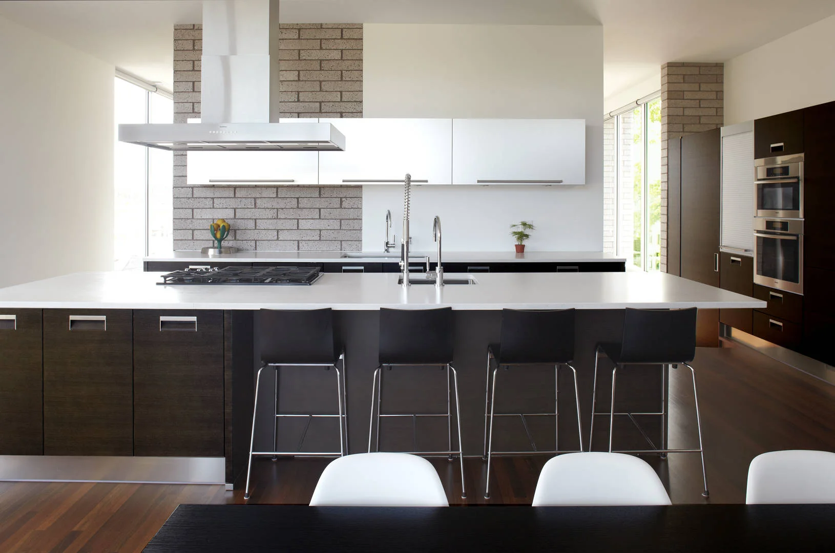 3701 S Parnell Single-Family Home Location: Chicago, IL Photos: Marty Peters Project Description: “Transparent Glimpses” In this residence, the standard organization of main public levels on the first floor and private bedroom levels on the upper floors was re-envisioned. Instead, the main public level was pushed to the top floor and designed as an open plan to take advantage of the natural light and city views. To keep a connection from the main entry to this level, a large gracious foyer and stair atrium was created and extended through all levels of the residence. The main feature of this residence is the “hidden garden” outdoor space. It is fully enclosed by the residence to one side and 14 foot walls to its neighbors. The hidden garden ties together the interior spaces and the 3 story atrium, while enhancing the penetration of natural light into the residence. The hidden garden is carefully arranged to offer glimpses to by passers on the street.
