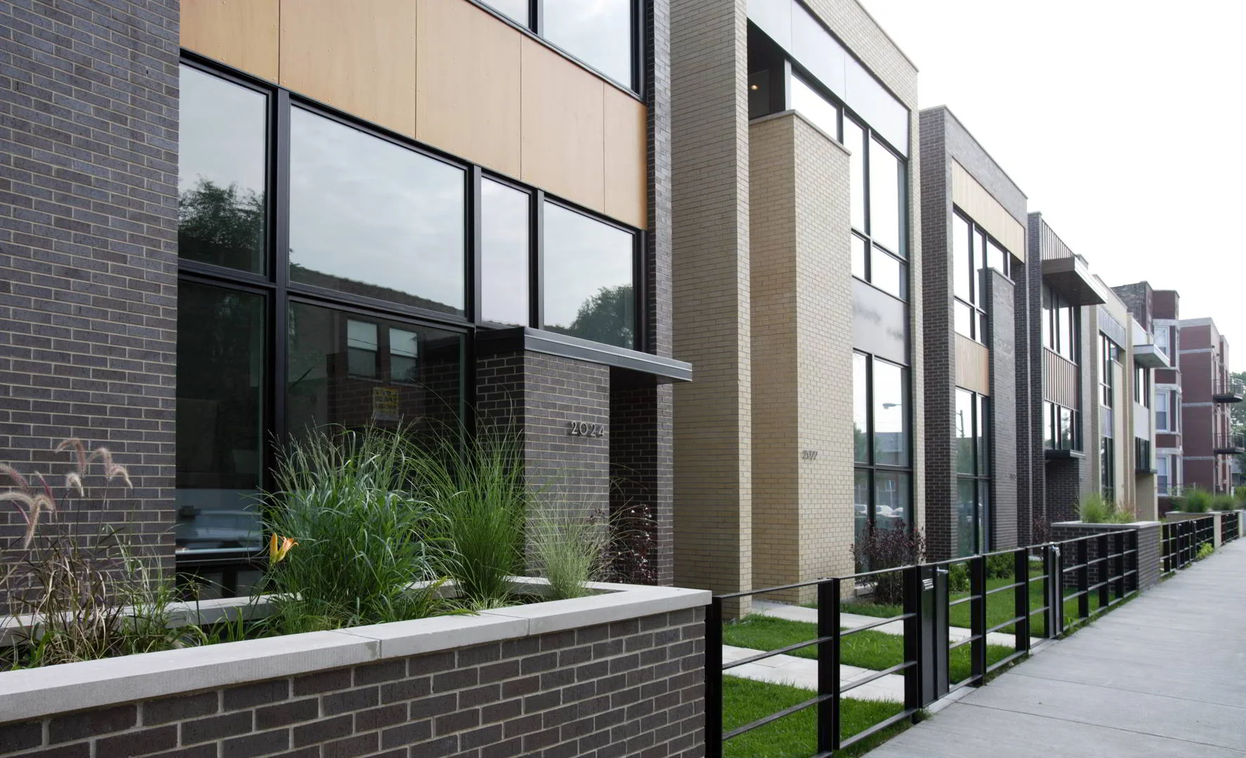 Single-Family Location: Chicago, IL Photos: Marty Peters 2006 Builder's Choice Awards Conveying a strong sense of community on this quiet residential street, these six single family homes redefine elegance and comfort. The homes remain discreet in scale, and respond to the culturally rich neighborhood, utilizing “soft” distinctive materials, such as brick and copper. Each will be strikingly individual, yet balance each other in this remarkable community of homes. Each home has an inviting lushly landscaped front yard, complementing existing residential homes on the street. The interiors of the homes will filter warm southern light through the layered spaces, accentuating the open, flexible planning. The careful use of glass and dramatic spatial volumes create a breathtaking connection between the homes, the neighborhood and the city. Intriguing back yard arrangements will encourage a communal coherence between neighbors, while respecting privacy and security. With simple yet aesthetically strong compositions, these homes, created by Studio Dwell Architects will entice the senses and captivate the individual.