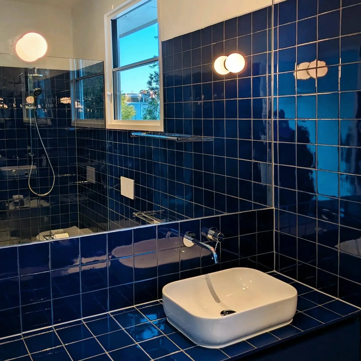 Under Construction: 💙 Crisp navy blue tiles plus a mirror for Tardis-like space expansion in the bathroom at #battenporchhouse 
🛠️: @mittyandprice 
#OOFarchitecture #OOFwip #burnley