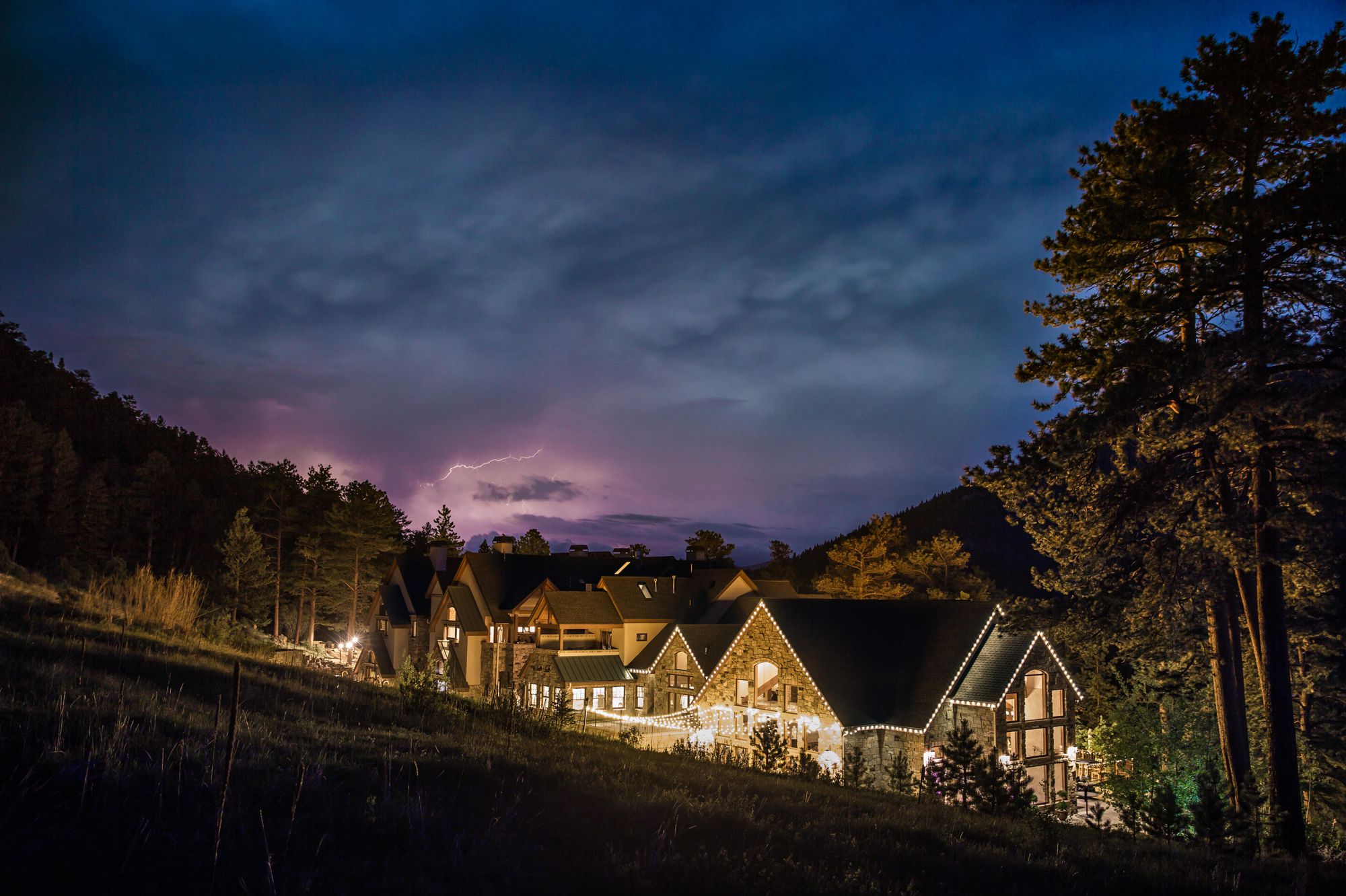 As we packed up our gear from Brent & Kelly's wedding, an evening summer storm started rolling over Della Terra and Estes Park. Kris took his chances at capturing lighting over Estes and ran up the hill to capture this gorgeous shot! God's pictures are amazing!!