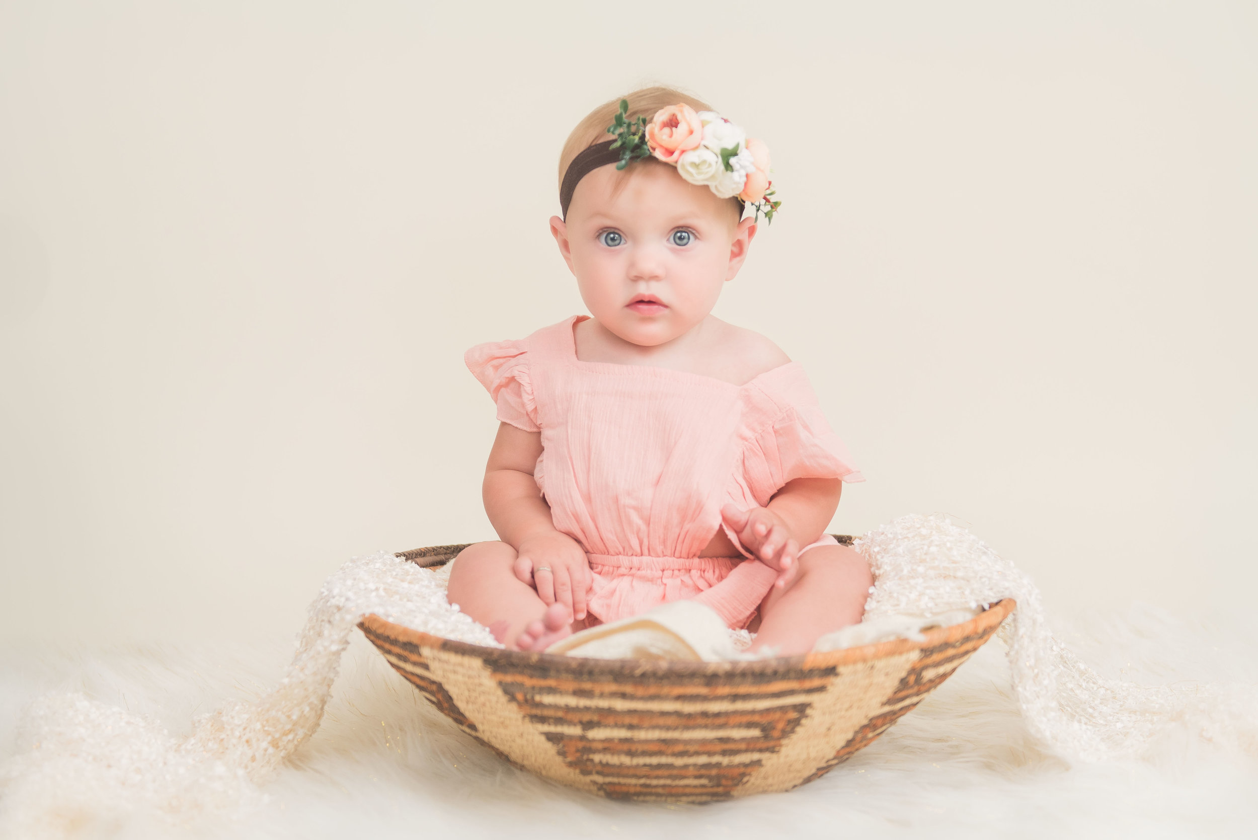 9 month old in basket