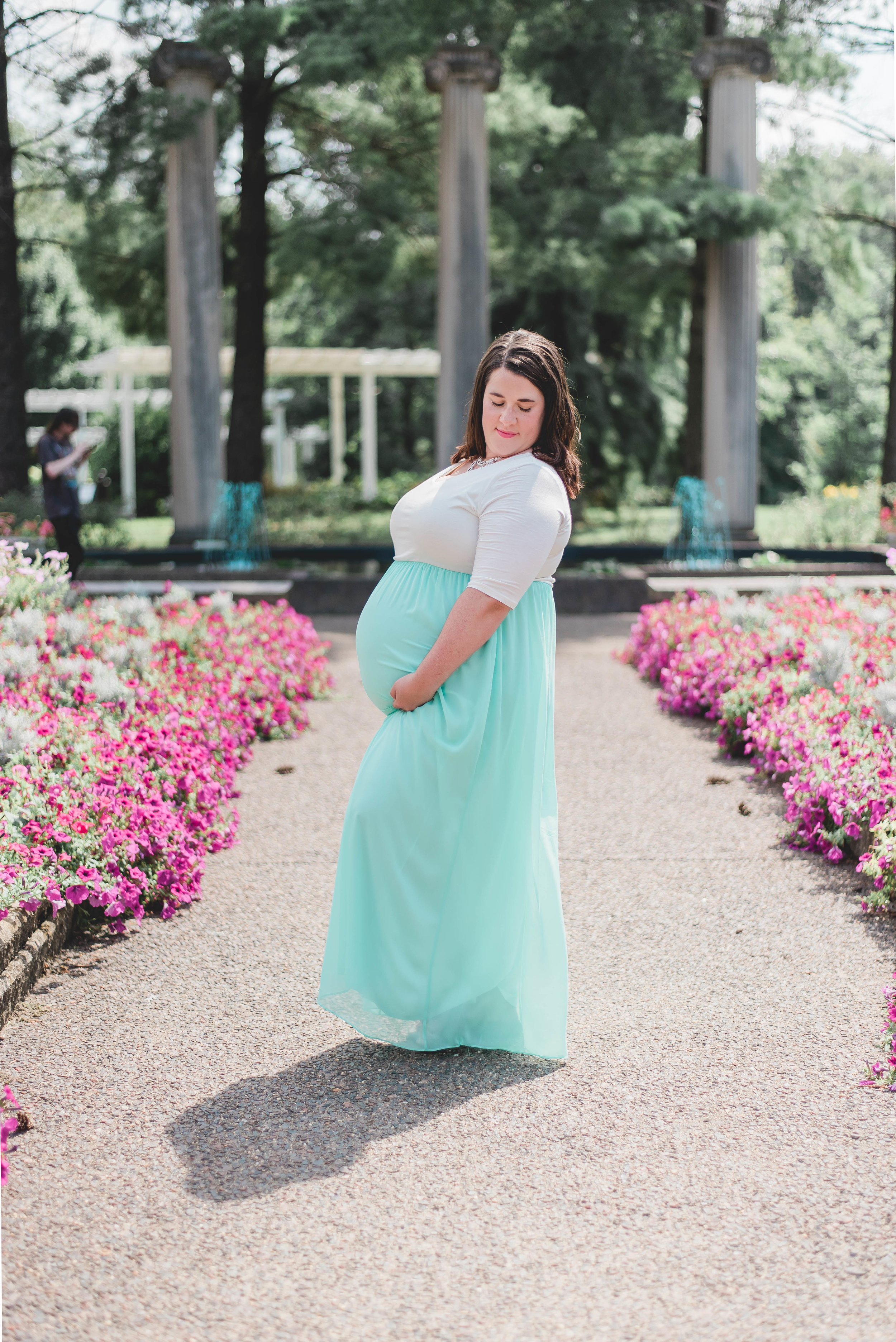 maternity photos with flowers leading lines