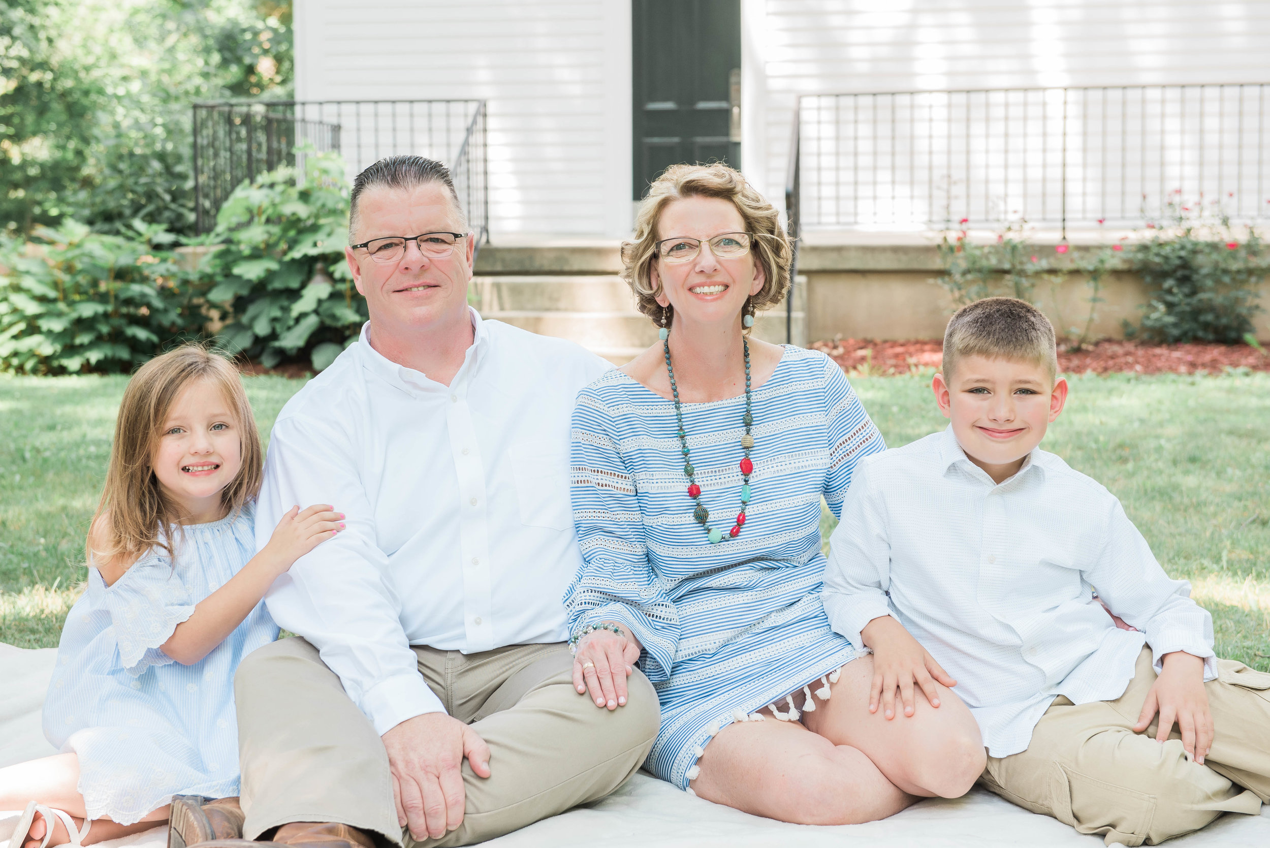 grandparents and grandkids pose outside