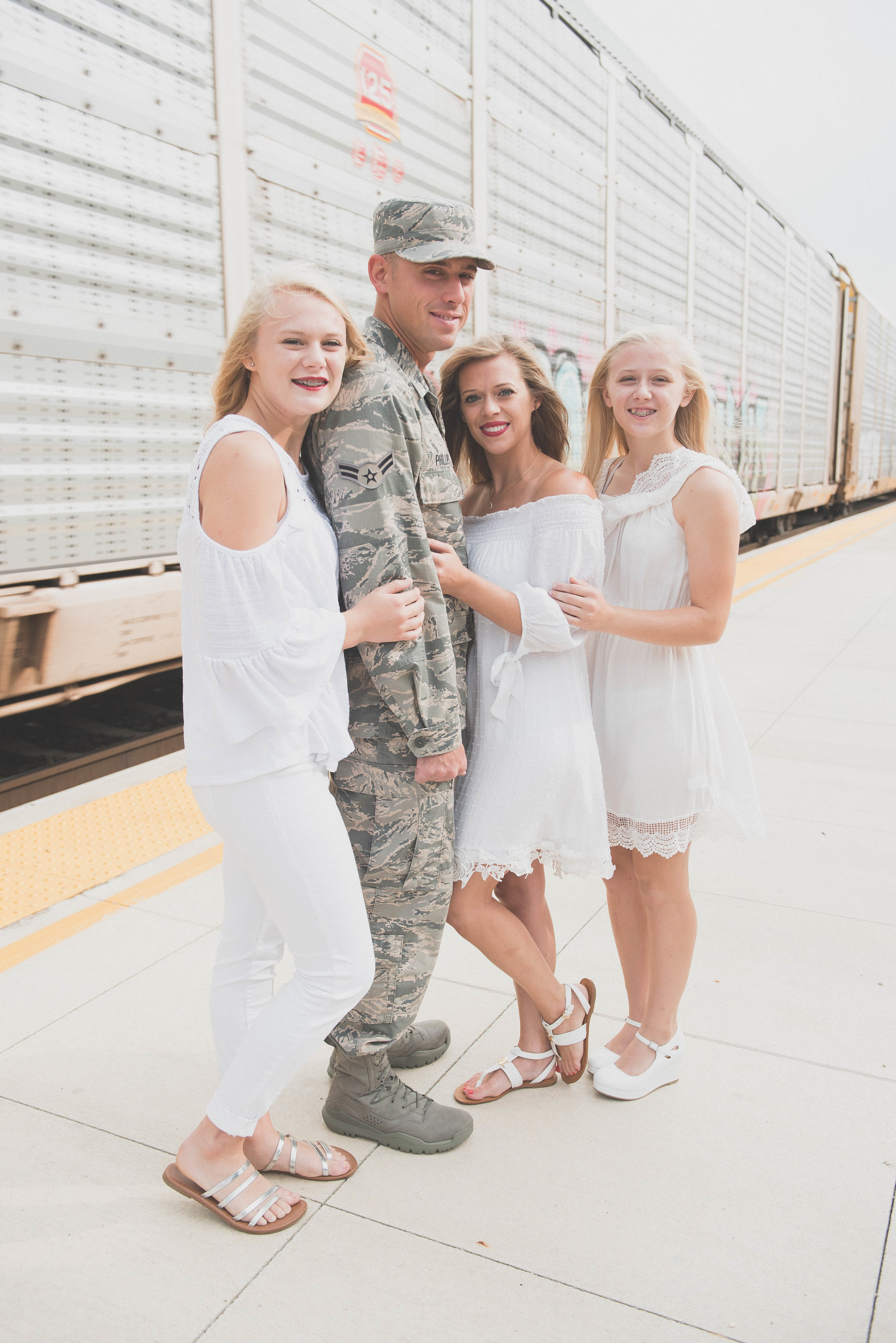 family photo in front of train