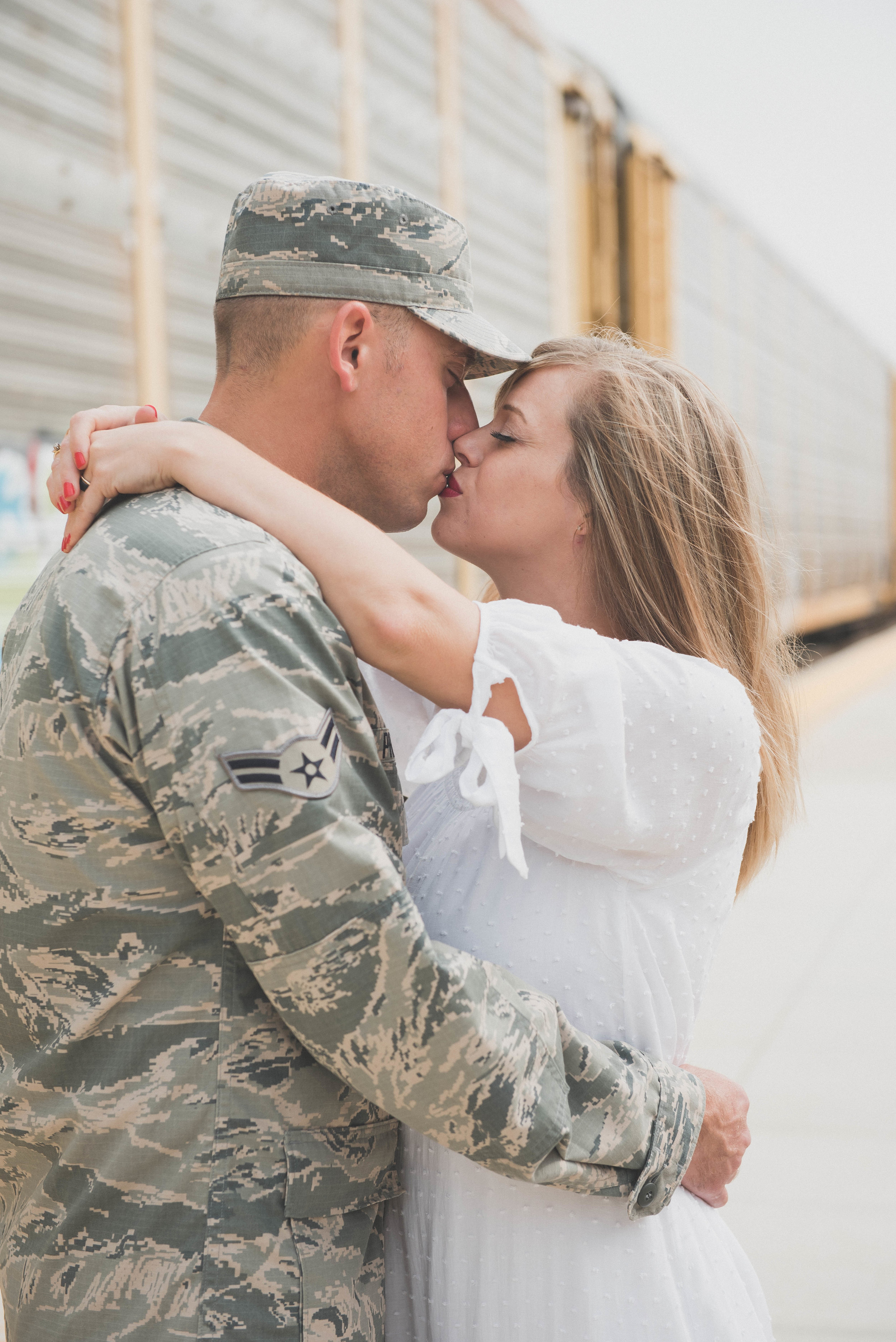 close up kiss in front of train military