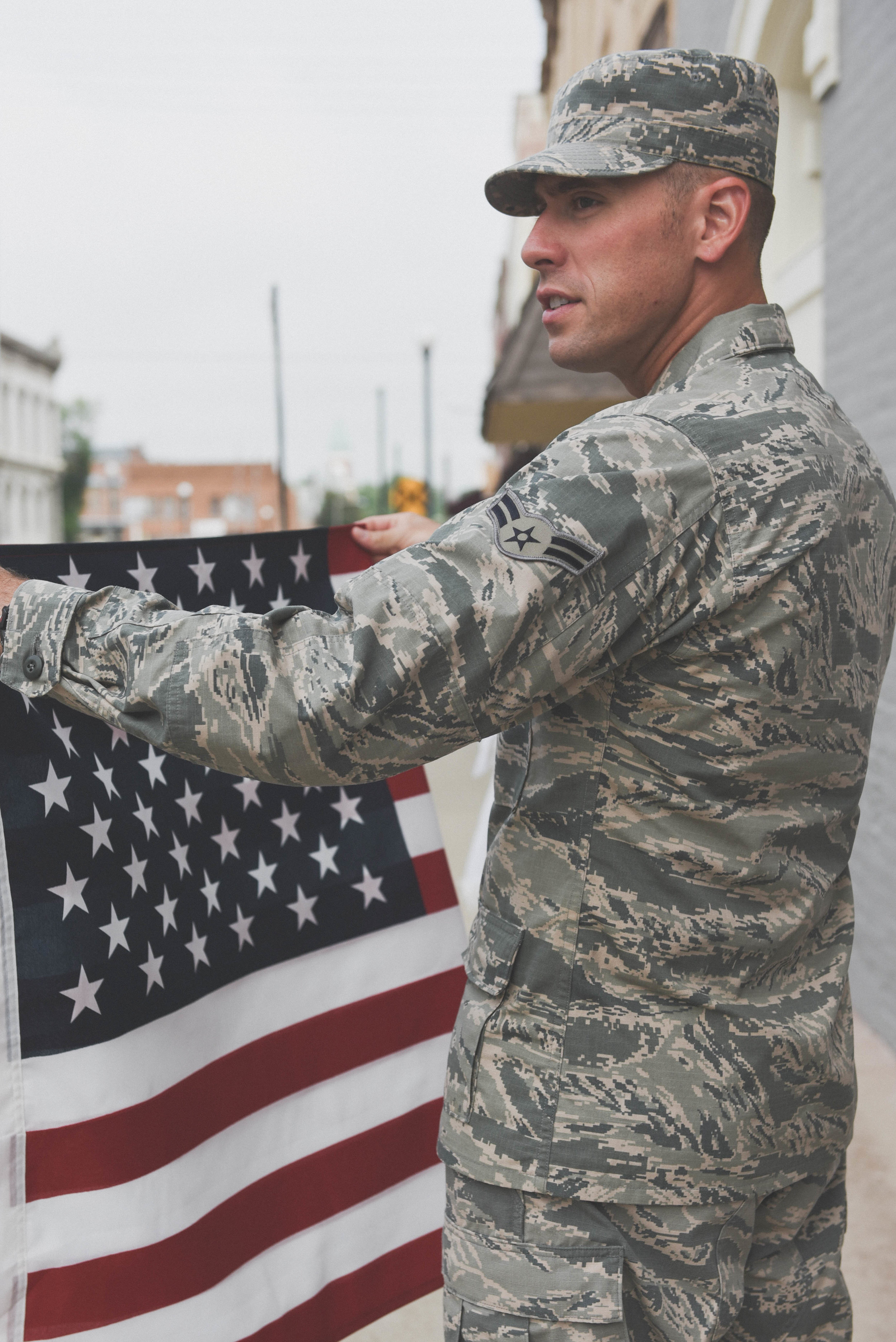 military man folding flag