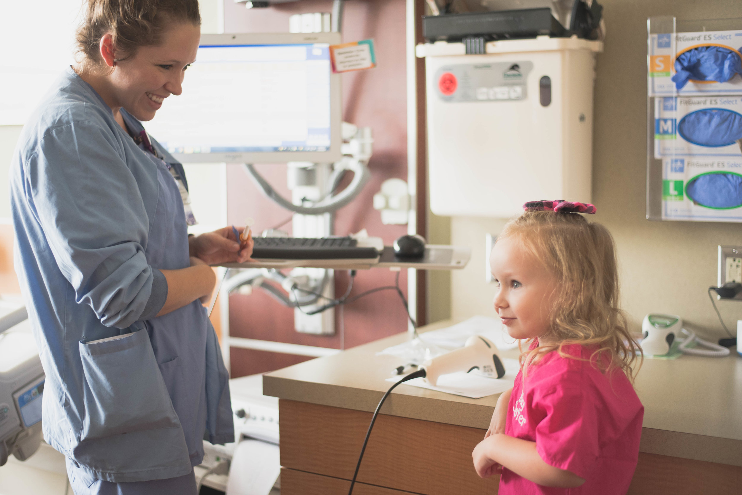 sister and nurse smile