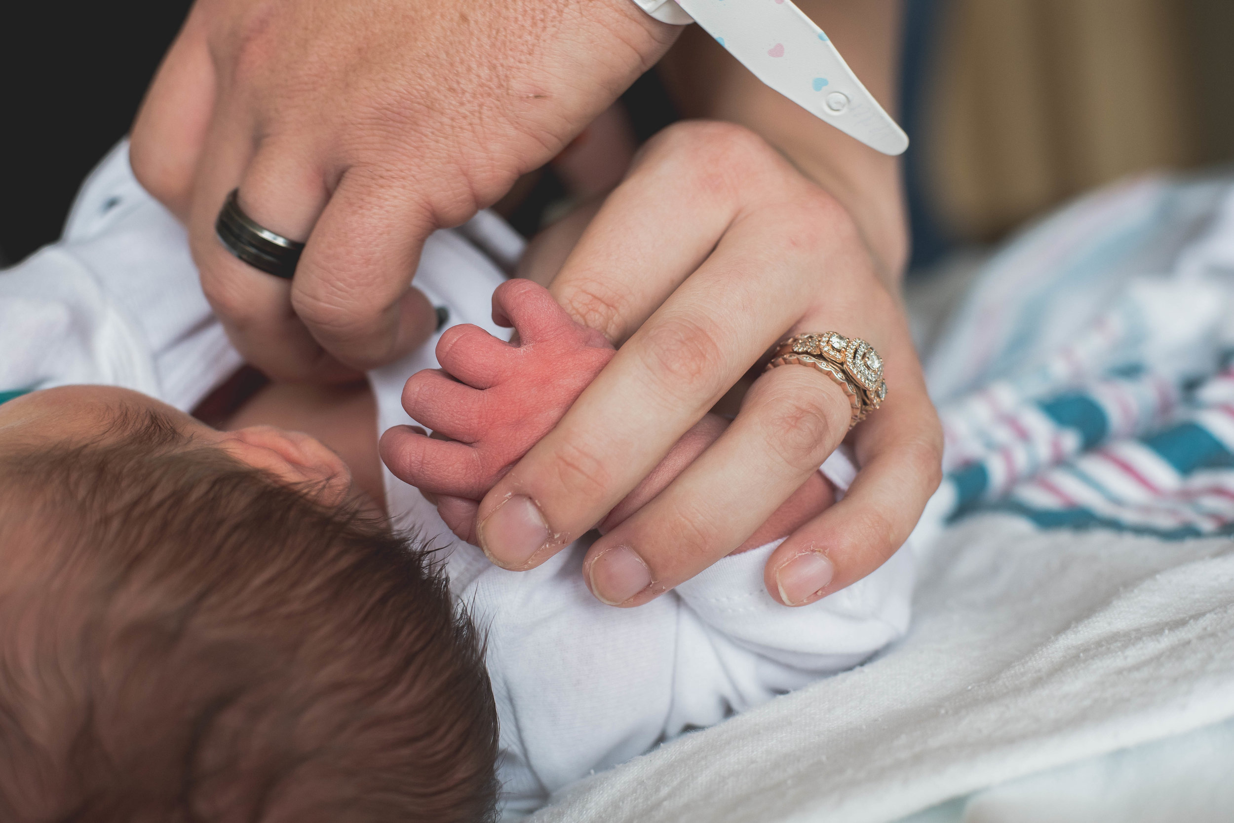 holding moms finger