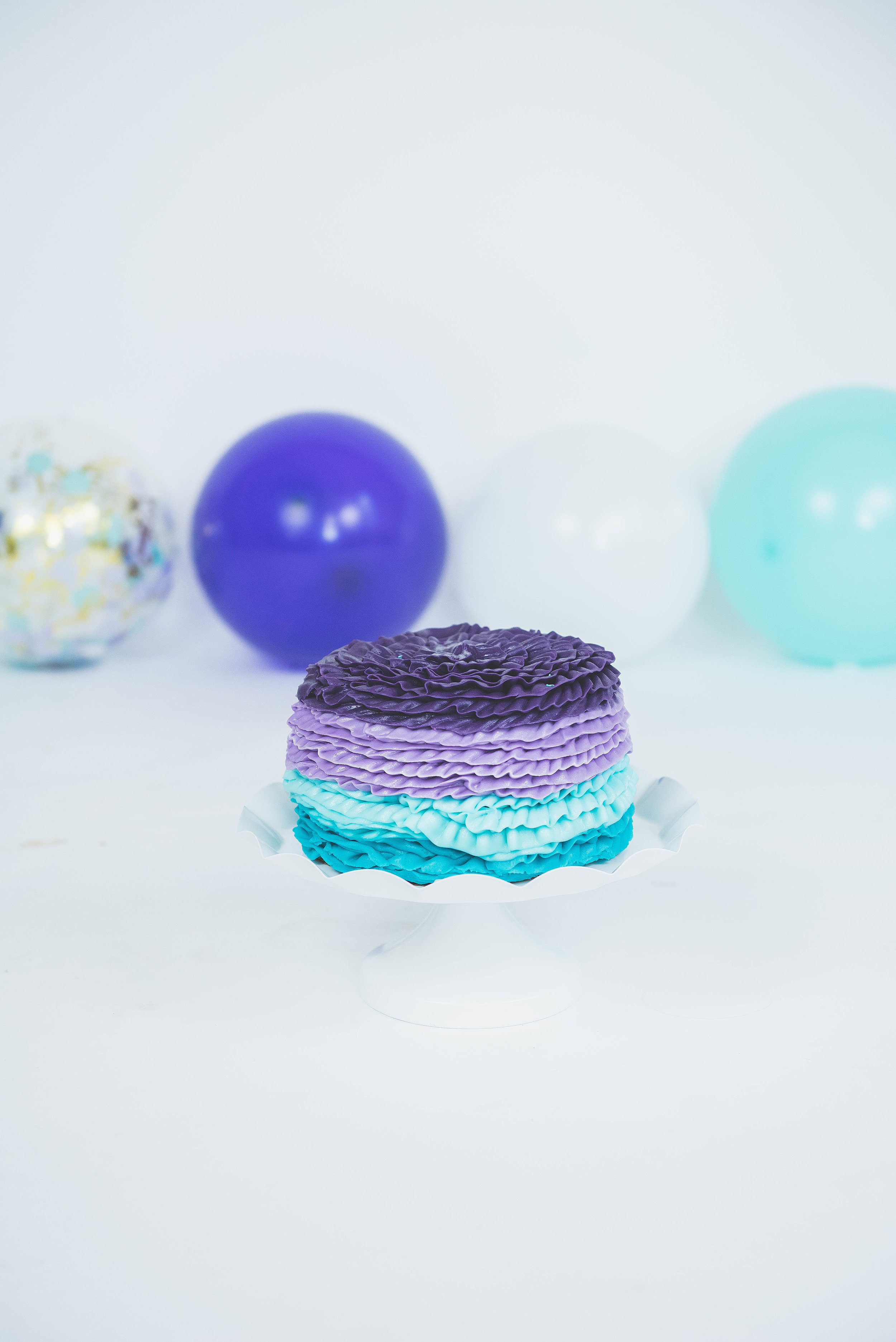 purple &amp; turquoise smash cake
