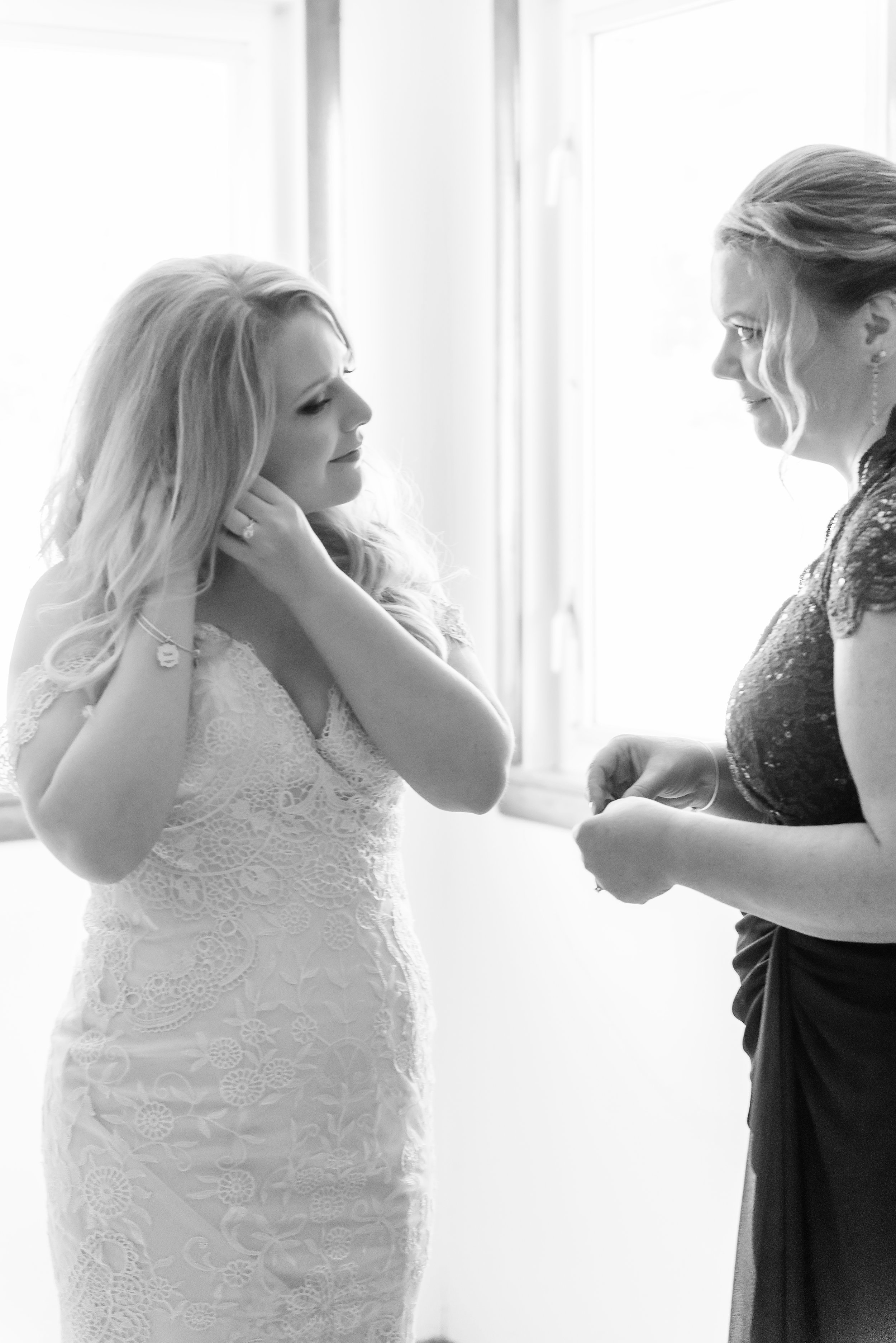 bride putting on earring