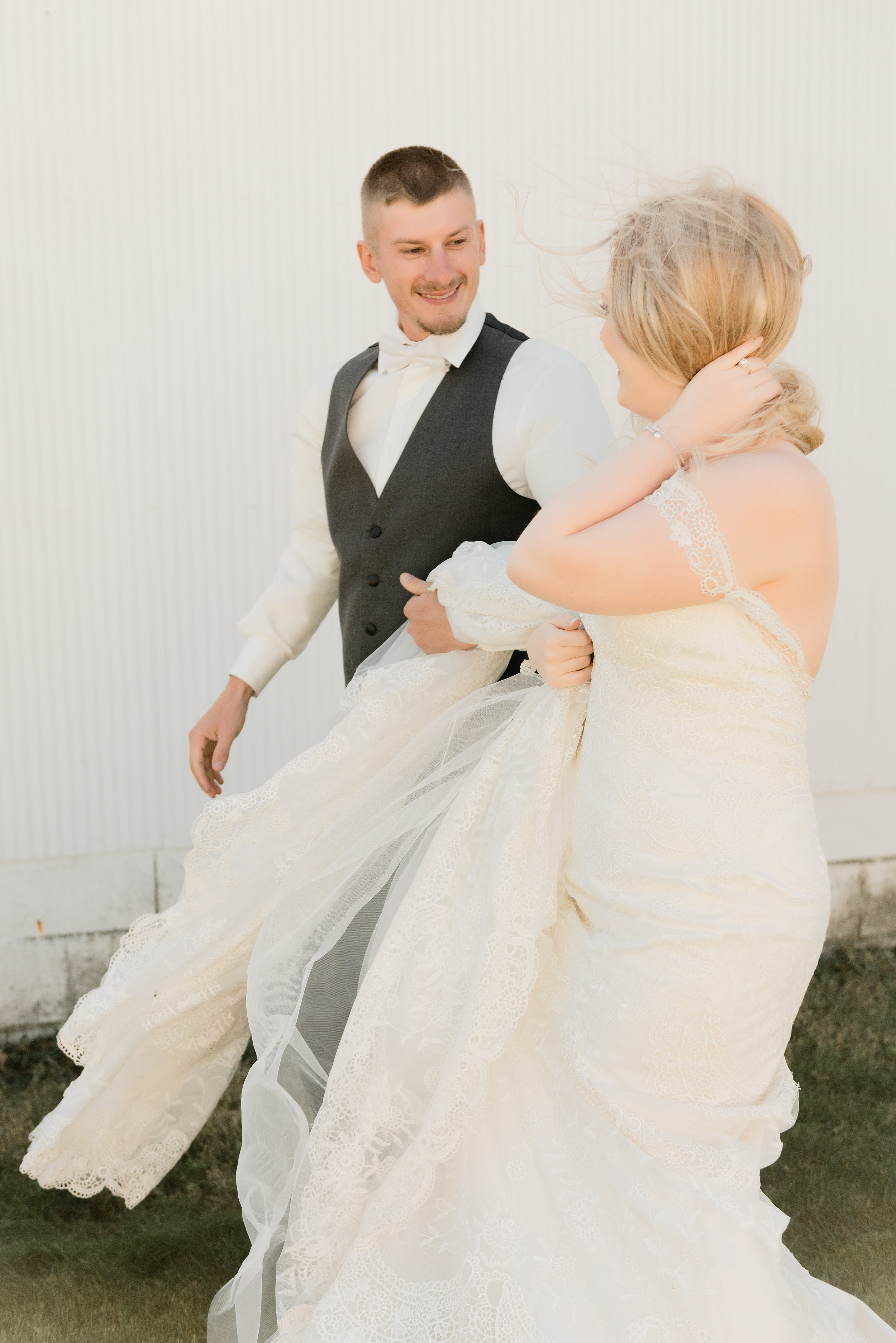 candid bride &amp; groom walking