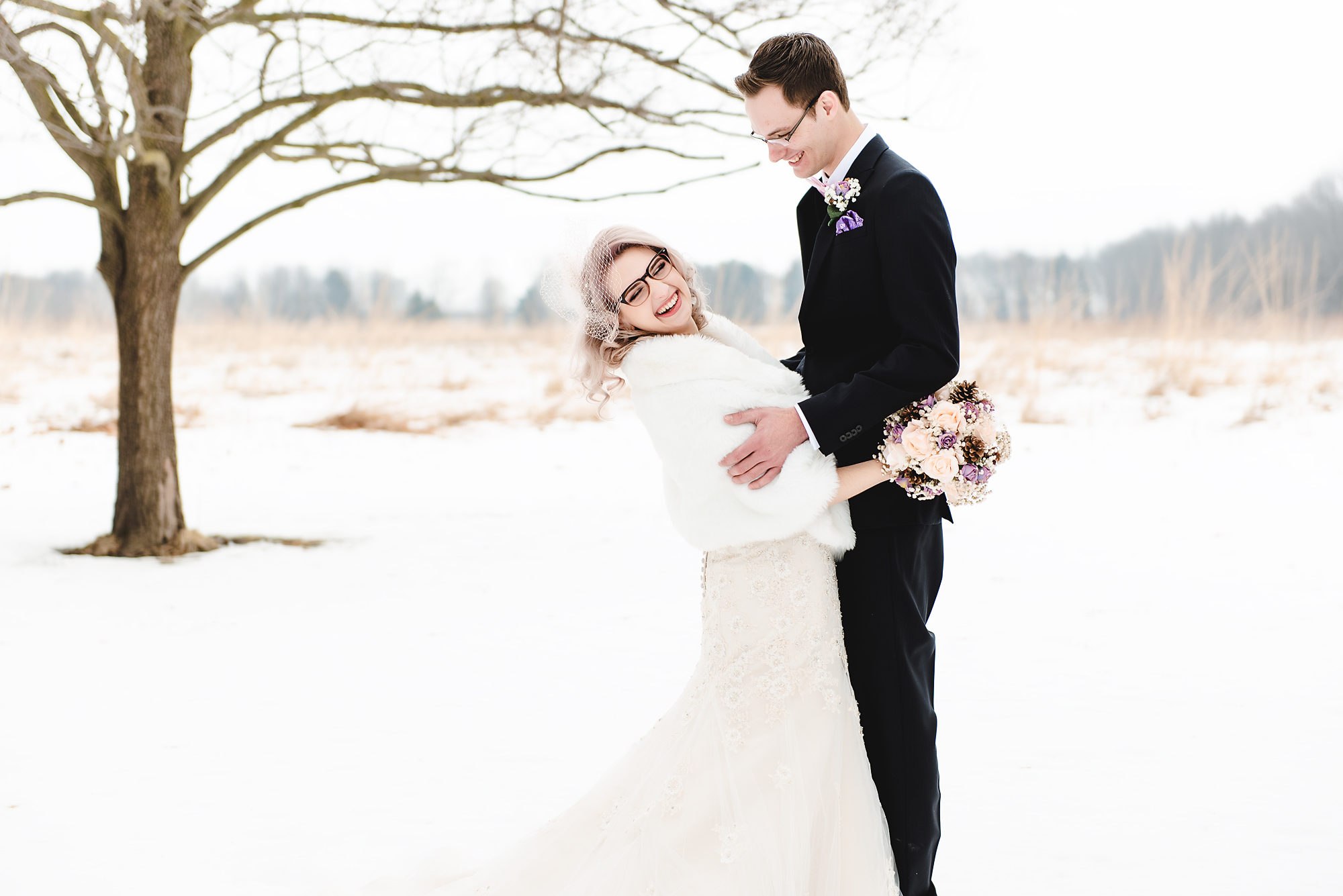 bride and groom snow portrait