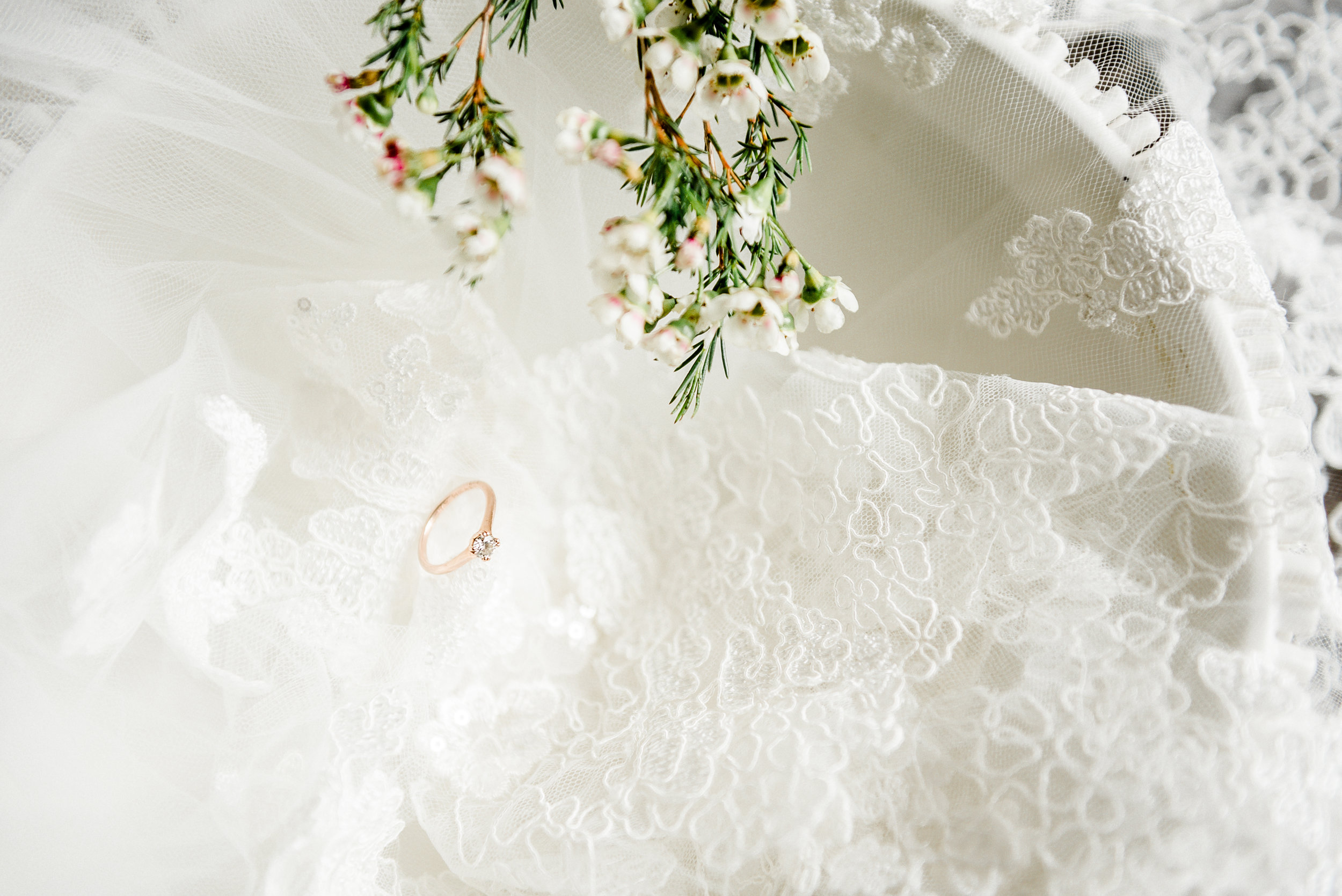 ring in white bowl with lace